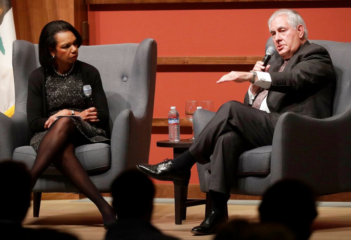 Secretary of State Rex Tillerson, right, speaks with former Secretary of St...