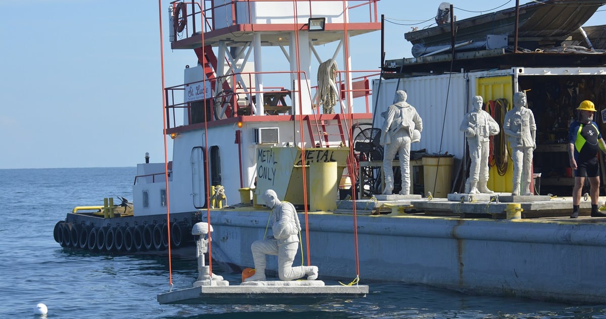 Statues Lowered Into Ocean For Veterans Underwater Dive Memorial