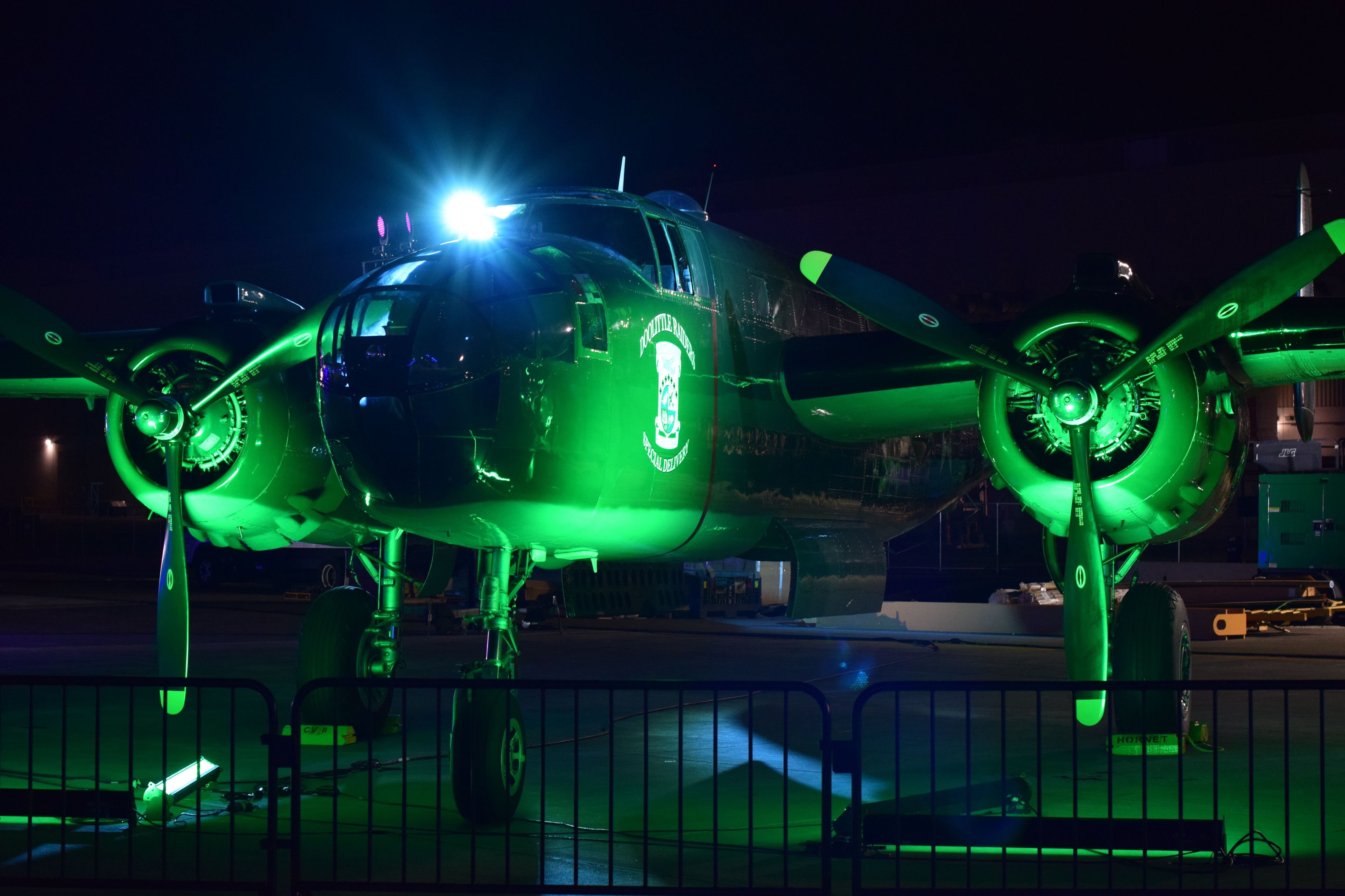A nighttime shot of a World War II-era B-25 Mitchell after the B-21 rollout ceremony. The Doolittle Raiders flew B-25s of this kind on their daring 1942 raid on Tokyo, Japan. The B-21 Raider was named in honor of the Doolittle Raiders, and the rollout ceremony included tributes to them. (Stephen Losey/Staff)