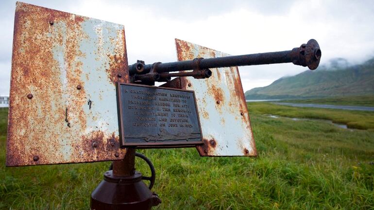 In this Aug. 22, 2017, photo provided by the U.S. Fish and Wildlife Service, an artillery monument sits above Massacre Bay on Attu Island, Alaska. One of the bloodiest World War II battles in the Pacific was waged 75 years ago this month on Attu Island in Alaska's Aleutian Islands. American forces reclaimed the island on Memorial Day 1943, 11 months after Japan seized it. (Lisa Hupp/U.S. Fish and Wildlife Service via AP)