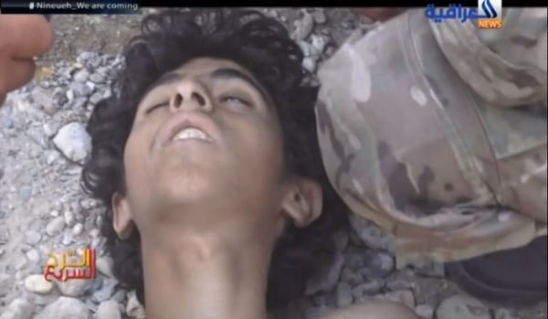 The seriously wounded Islamic State fighter, believed to be between 15 and 17 years of age, military prosecutors believe was murdered by a Navy SEAL. (screen shot of YouTube video used as evidence in criminal hearing)