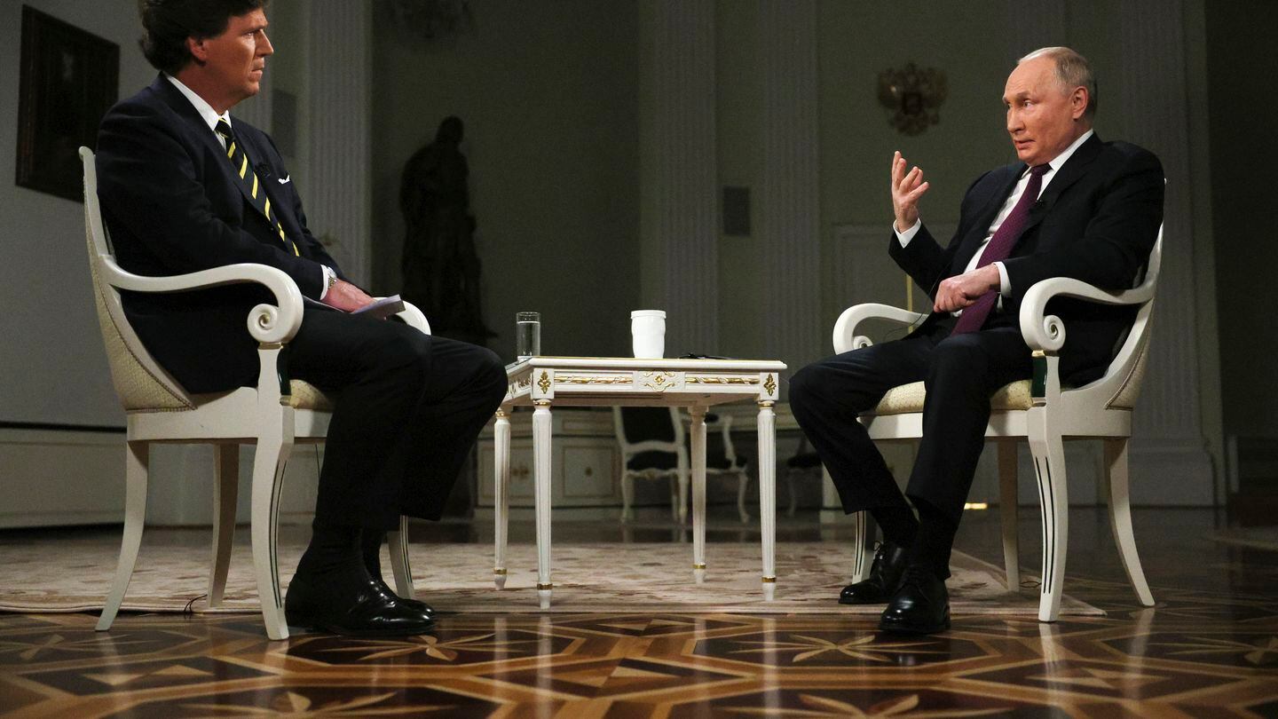 In this photo released by Sputnik news agency on Friday, Feb. 9, 2024, Russian President Vladimir Putin, right, gestures as he speaks during an interview with former Fox News host Tucker Carlson at the Kremlin in Moscow, Russia, Tuesday, Feb. 6, 2024. (Gavriil Grigorov, Sputnik, Kremlin Pool Photo via AP)