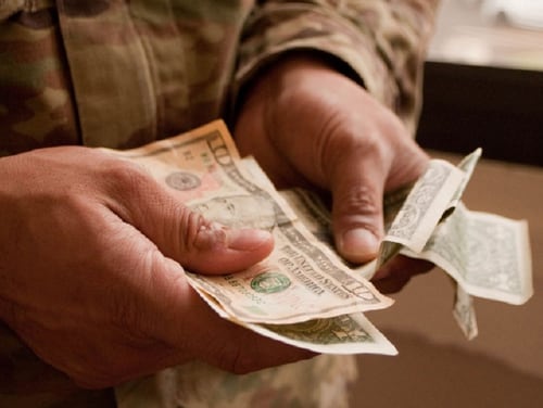 A provision in the upcoming spending bill would ease troops' pain in repaying the deferred payroll taxes. (Kristen Wong/DoD)