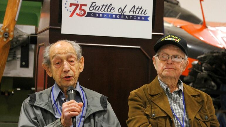 In this May 19, 2018, photo World War II veterans Allan Seroll, left, of Massachusetts, and William Roy Dover, right, of Alabama, right, attend a 75th anniversary celebration of the Battle of Attu in Anchorage, Alaska. Dover was an American soldier who took part in the May 1943 effort to reclaim Alaska's Attu Island from the Japanese. It was the only World War II battle fought on North American soil. (Mark Thiessen/AP)