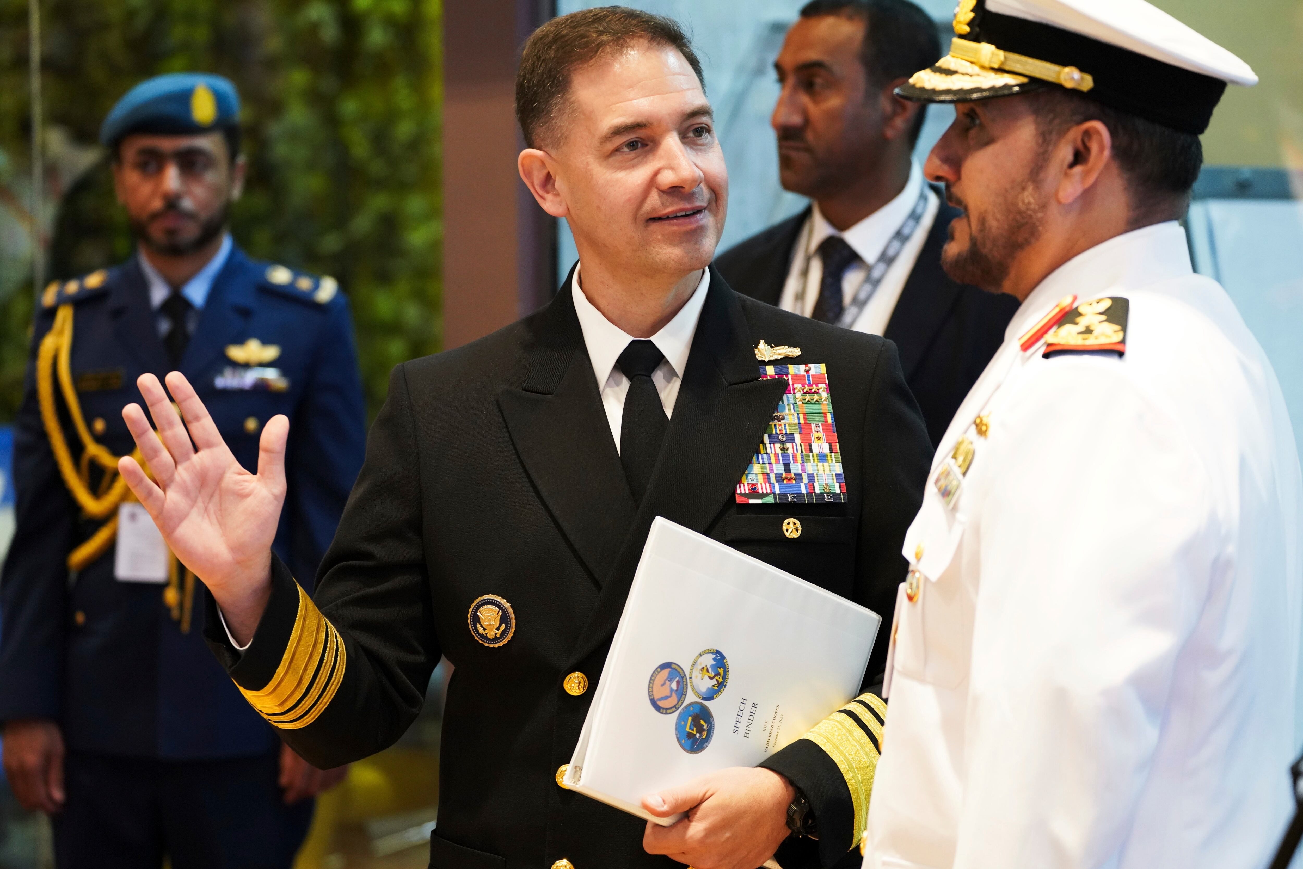 U.S. Navy Vice Adm. Brad Cooper, who heads the Navy's Bahrain-based 5th Fleet, gestures on the sidelines of an event at the International Defense Exhibition and Conference in Abu Dhabi, United Arab Emirates, Tuesday, Feb. 21, 2023.