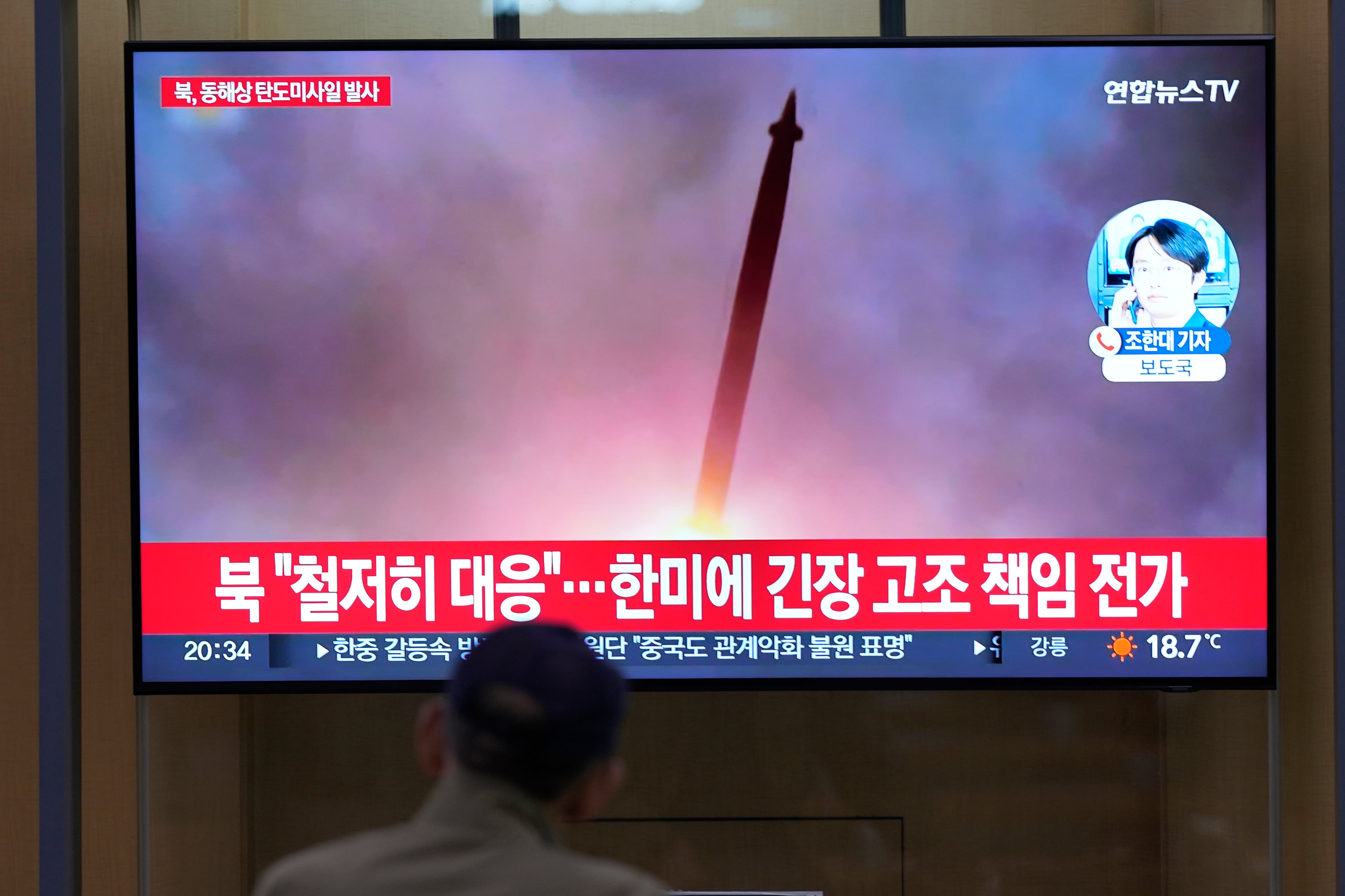 A TV screen shows a report of North Korea's missile launch with file image during a news program at the Seoul Railway Station in Seoul, South Korea, Thursday, June 15, 2023.