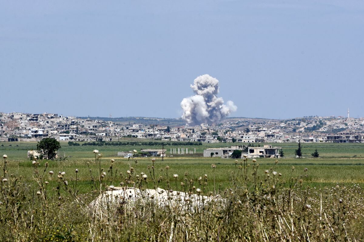 Smoke billows from the town of Habeet after shelling by Syrian army forces from the adjacent town of Kafr Nabuda on May 11, 2019.