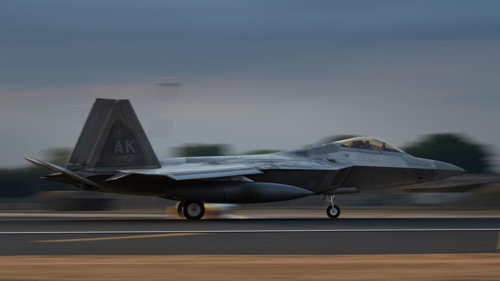 An F-22 Raptor with the 90th Fighter Squadron, 3rd Wing, Joint Base Elmendorf-Richardson, Alaska, lands at Royal Air Force Lakenheath, England, July 26, 2022. This enhanced posture shows NATO’s commitment to readiness which promotes regional security and stability. (Airman 1st Class Cedrique Oldaker/Air Force)