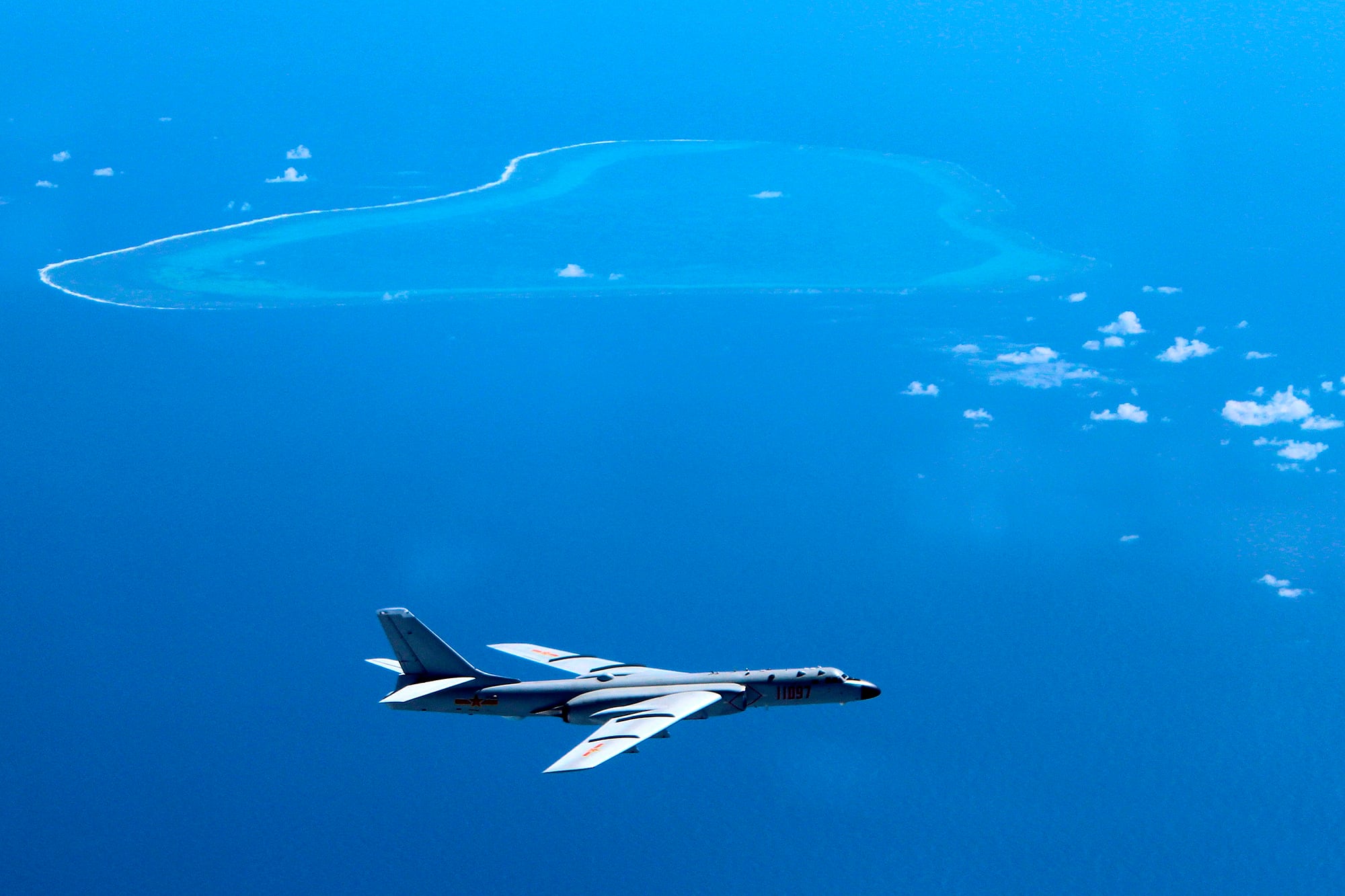 A Chinese H-6K bomber patrols the islands and reefs in the South China Sea in this undated photo.