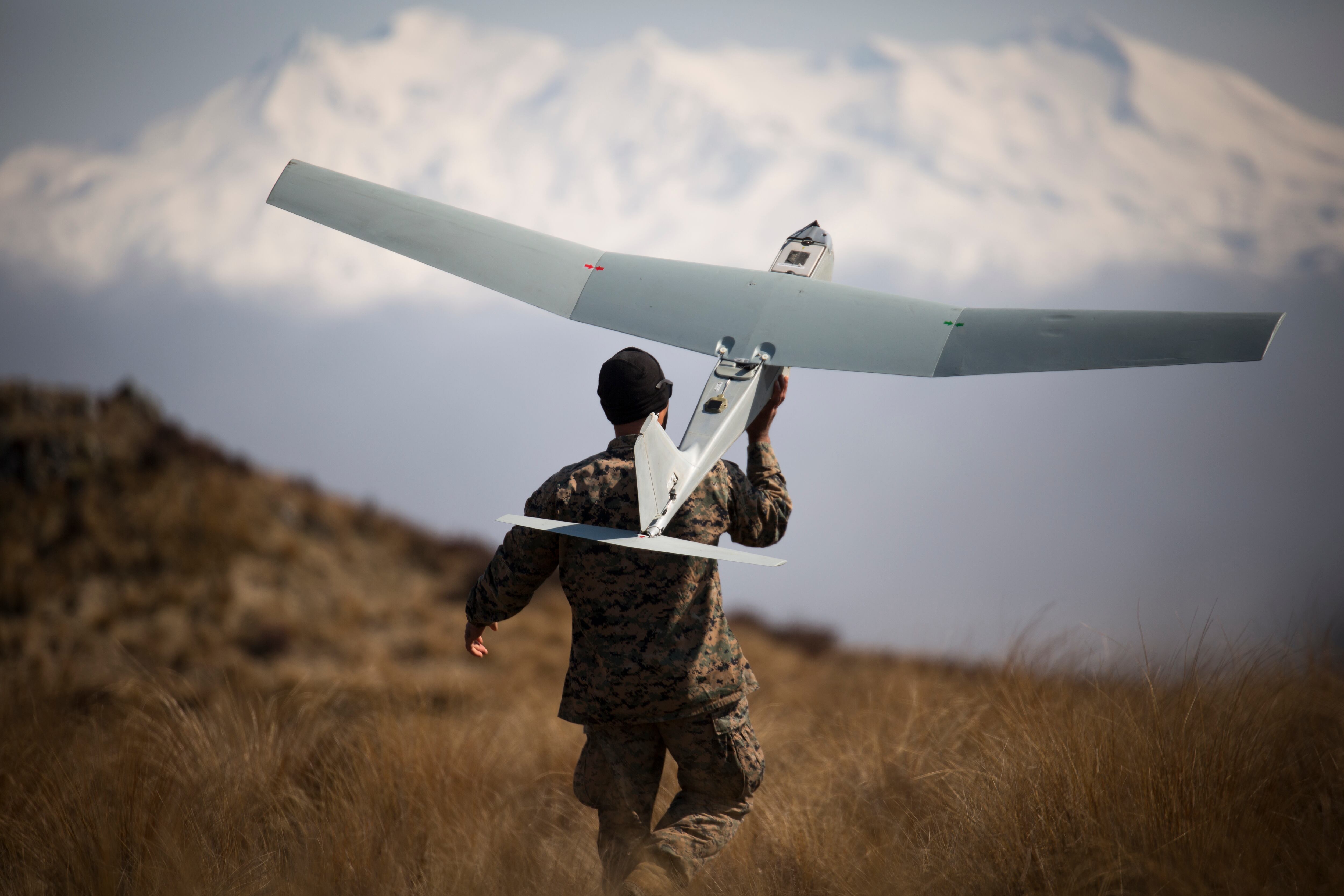 U.S. Marine Corps Sgt. Kevin Ware launches a small unmanned aircraft system as part of exercise Joint Assault Signals Company Black at Waiouru Military Camp, New Zealand, in September 2018.