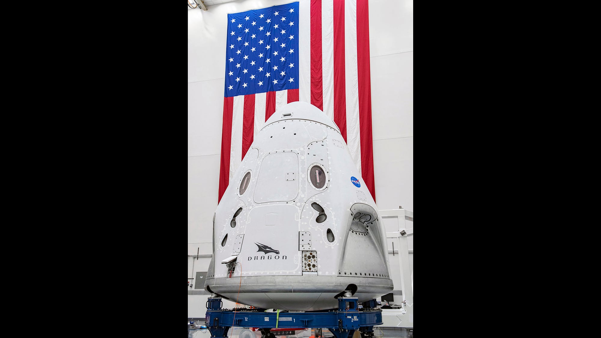 In this April 10, 2020, photo made available by SpaceX, the SpaceX Crew Dragon spacecraft undergoes final processing at Cape Canaveral Air Force Station, Fla.