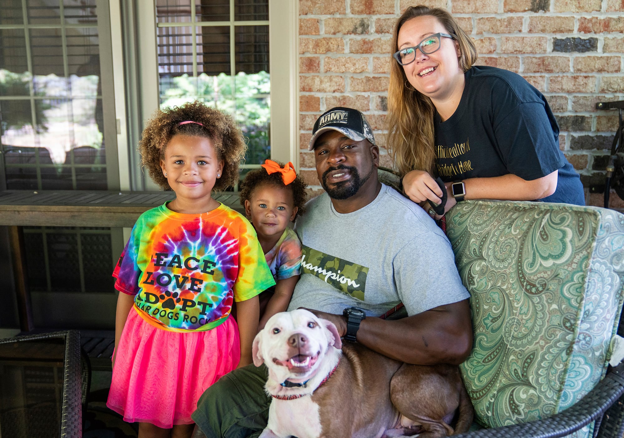 From left, Zaida Brooks, 5, Waverly Brooks, 2, their father, Omar Brooks, and mother, Nicole Malesic, pose for a photo with Maisie Mae, a foster dog at Bridge To Home Animal Rescue on Monday, July 6, 2020, in Eighty Four, Pa.