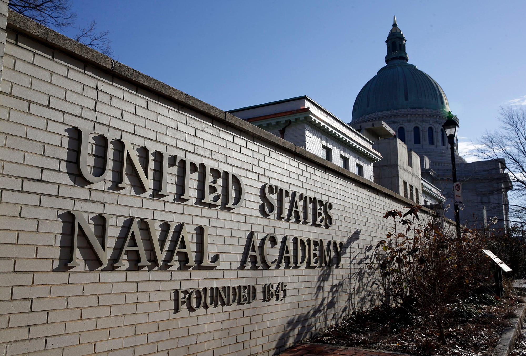 A sign stands outside of an entrance to the U.S. Naval Academy campus in Annapolis, Md., on Jan. 9, 2014.