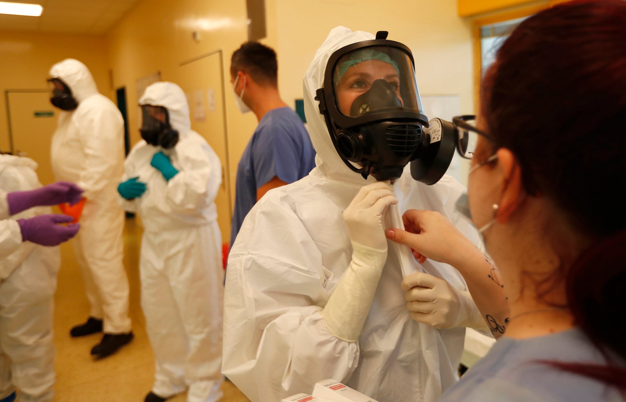 Health care workers prepare to transport a COVID-19 patient from an intensive care unit (ICU) at a hospital in Kyjov to hospital in Brno, Czech Republic, Thursday, Oct. 22, 2020.