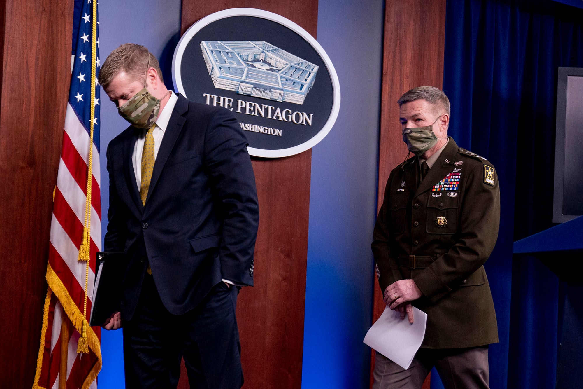 Secretary of the Army Ryan McCarthy, left, and Gen. James McConville, chief of staff of the Army, right, depart after speaking at a briefing on an investigation into Fort Hood, Texas, at the Pentagon, Tuesday, Dec. 8, 2020, in Washington.