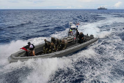 A visit, board, search and seizure team from the amphibious transport dock ship USS New Orleans (LPD 18) approaches a simulated suspect vessel during a training exercise Sept. 16, 2020, in the Philippine Sea.