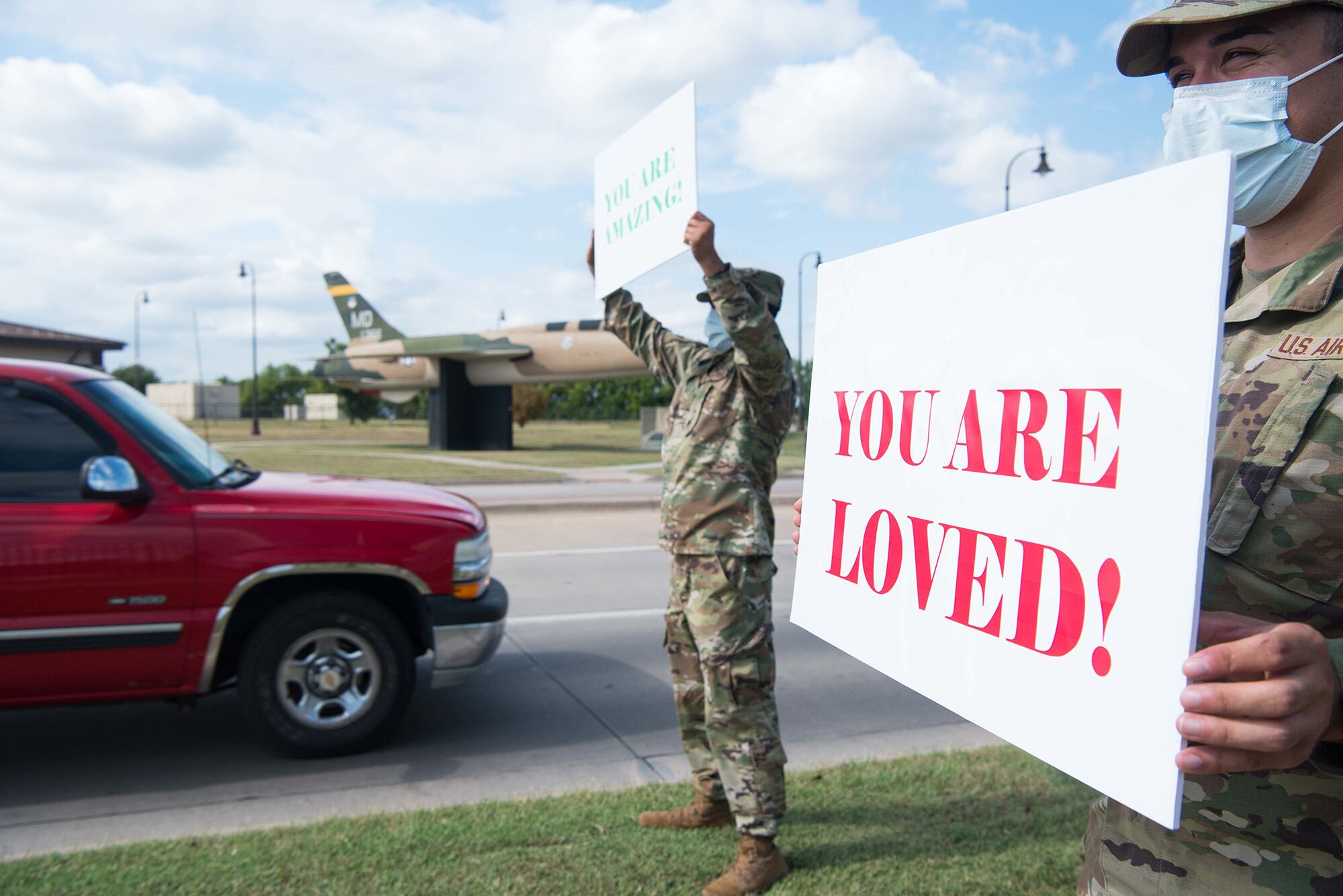 Senior Airman Brian Whitcomb, right, and Airman 1st Class DeMario Morgan, left, inspire members of Team McConnell Sept. 1, 2020, at McConnell Air Force Base, Kan., to ensure airmen knew they are not alone during National Suicide Prevention Month.