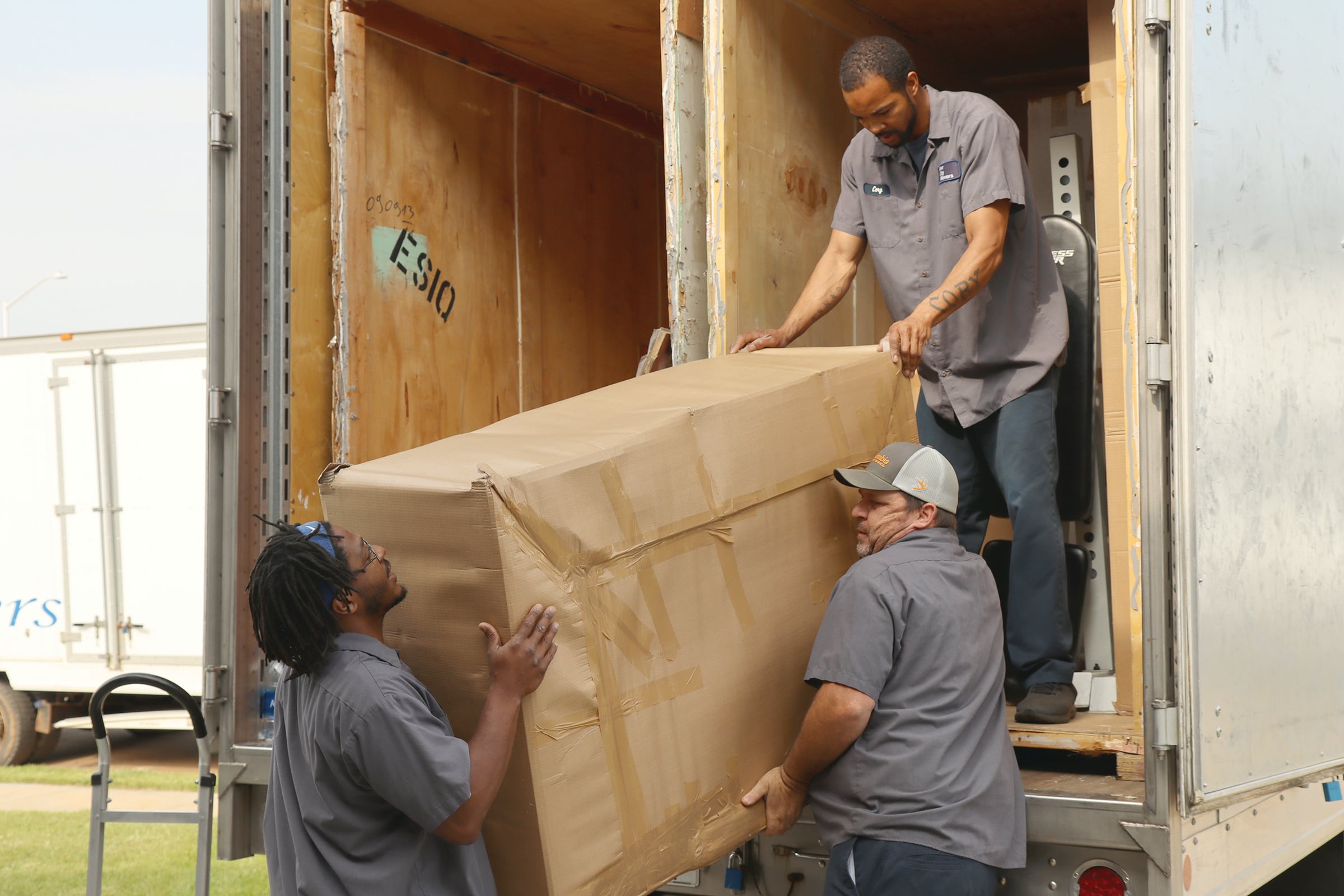 Workers from River City Movers conduct a direct delivery for a service member whose belongings were transported overseas from his previous duty station in Germany during a government move to Fort Campbell, Ky., on May 9, 2022.