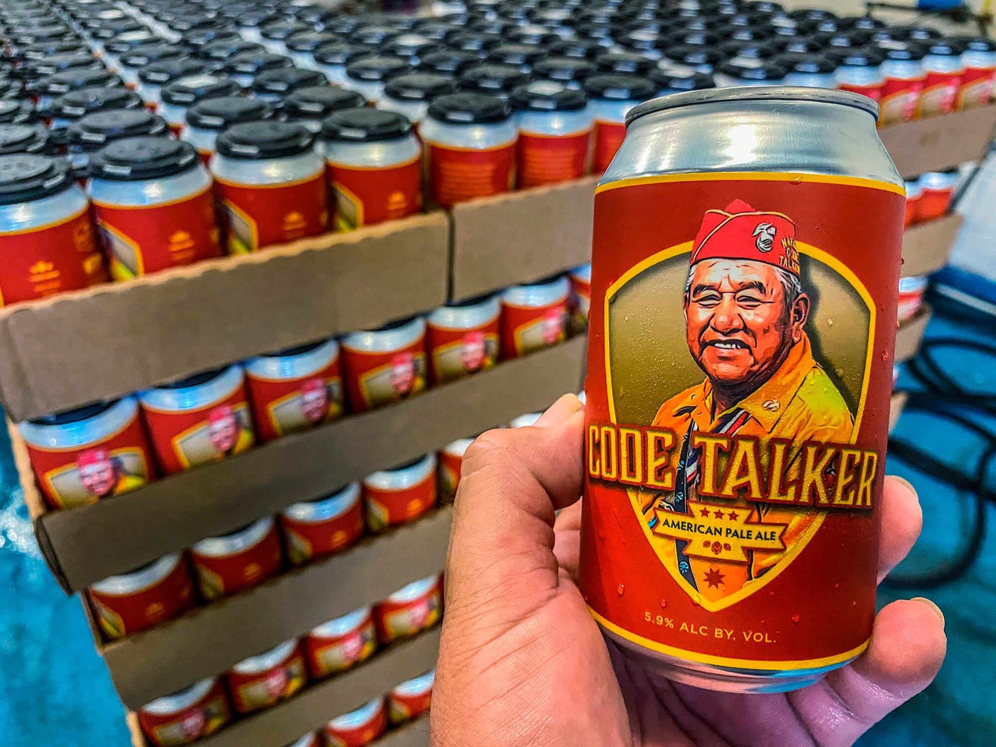 In this Aug. 14, 2020, photo LT Goodluck holds a beer can honoring his grandfather, Navajo Code Talker John V. Goodluck at the Hellbender Brewing Co., in Washington, D.C.