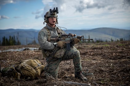 Hospital Corpsman 3rd Class Wayne Jaworski provides security after completing a free-fall insert during a Marine Corps combat readiness evaluation at Eielson Air Force Base, Alaska, Aug. 21, 2020.