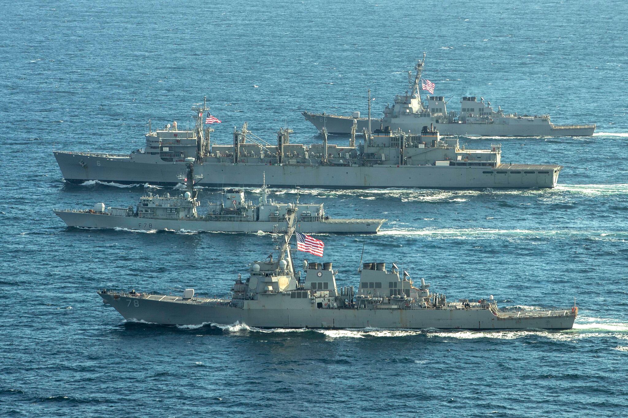 The Arleigh Burke-class guided-missile destroyer USS Porter (DDG 78), front, the Royal Navy Type-23 Duke-class frigate HMS Kent (F78), the fast combat support ship USNS Supply (T-AOE 6) and USS Roosevelt (DDG 80) conduct joint operations to ensure maritime security in the Arctic Ocean, May 5, 2020.