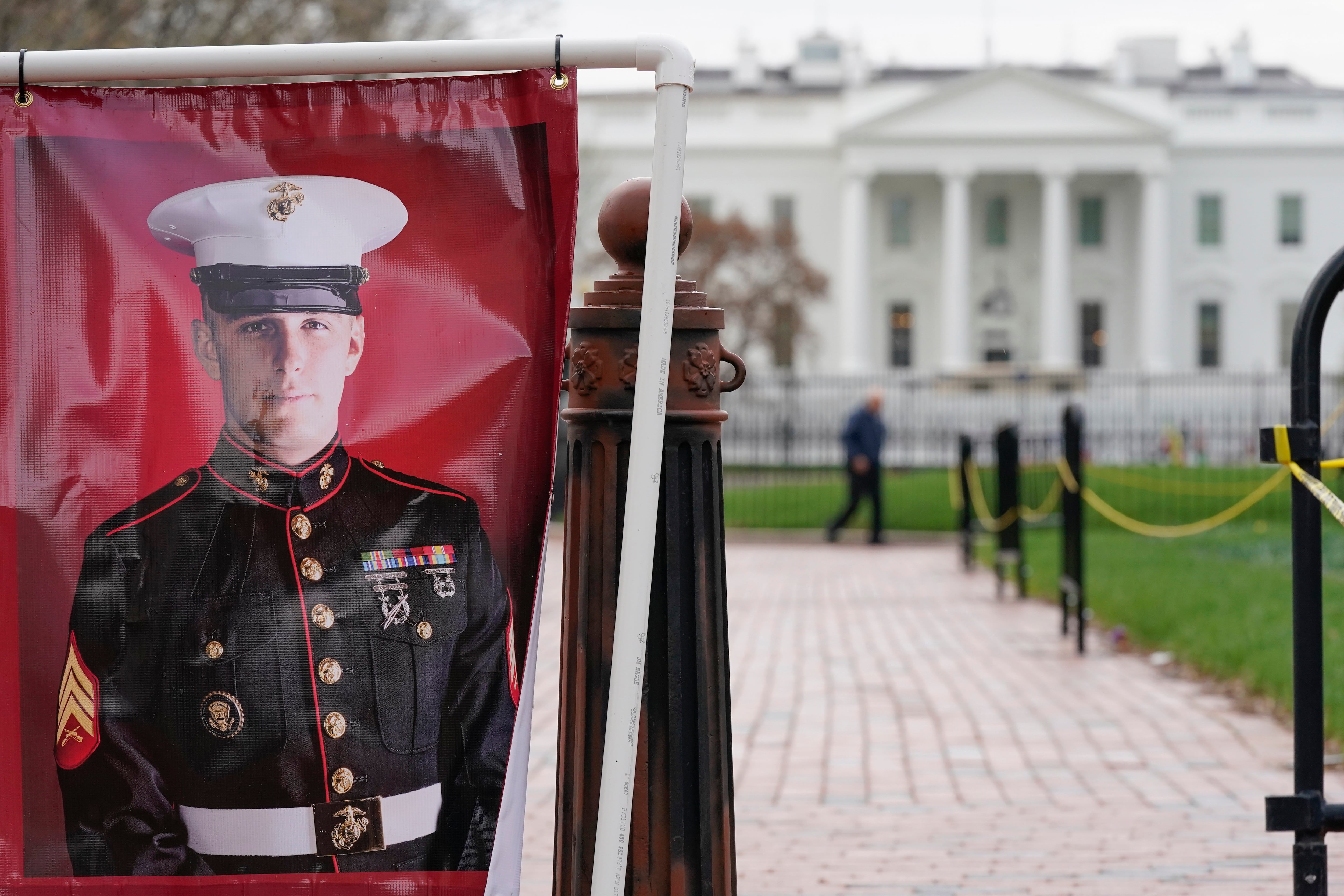 A poster photo of U.S. Marine Corps veteran and former Russian prisoner Trevor Reed stands in Lafayette Park near the White House, March 30, 2022, in Washington.