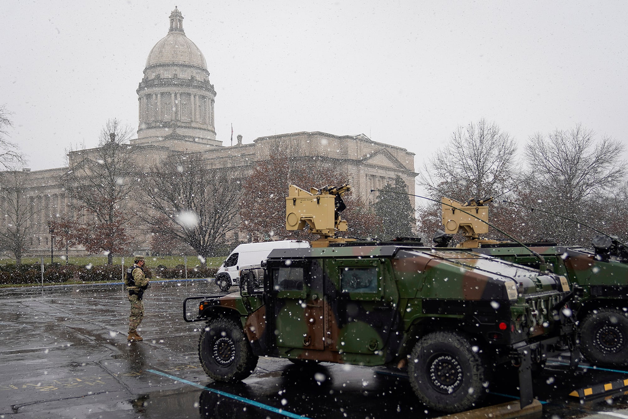 A National Guard soldier stands outside the Capitol building in Frankfort, Ky., Sunday, Jan. 17, 2021.