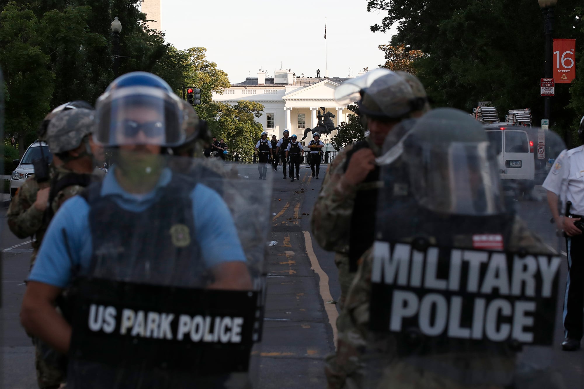 Police clear the area around Lafayette Park and the White House as demonstrators gather to protest the death of George Floyd, Monday, June 1, 2020, in Washington.