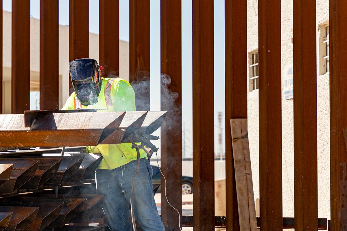 U.S. Army Corps of Engineers contractors place rebar at footings of retaining walls on June 20, 2019.