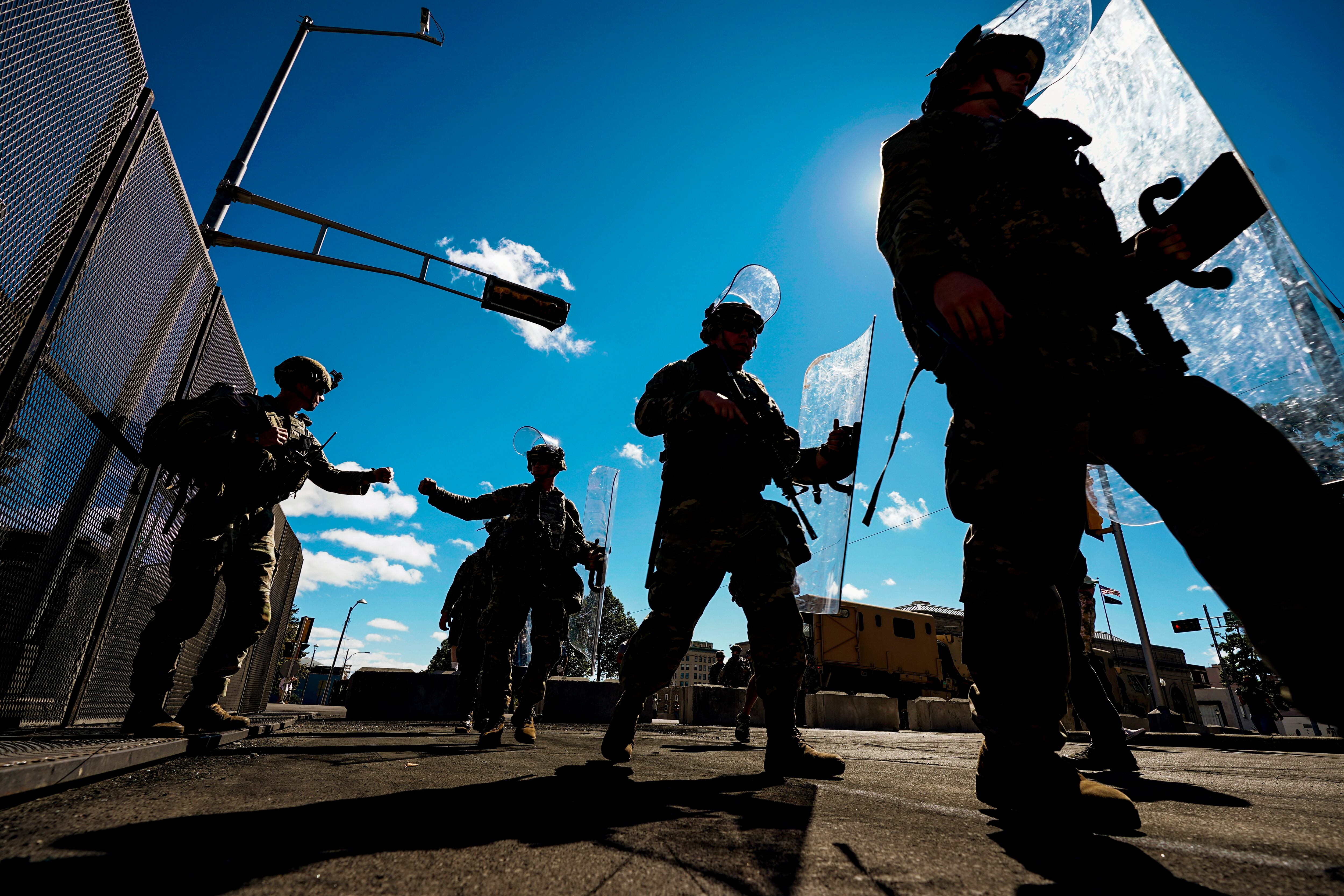 Wisconsin National Guard troops arrive at the Kenosha County courthouse on Aug. 30, 2020, in Kenosha, Wis.