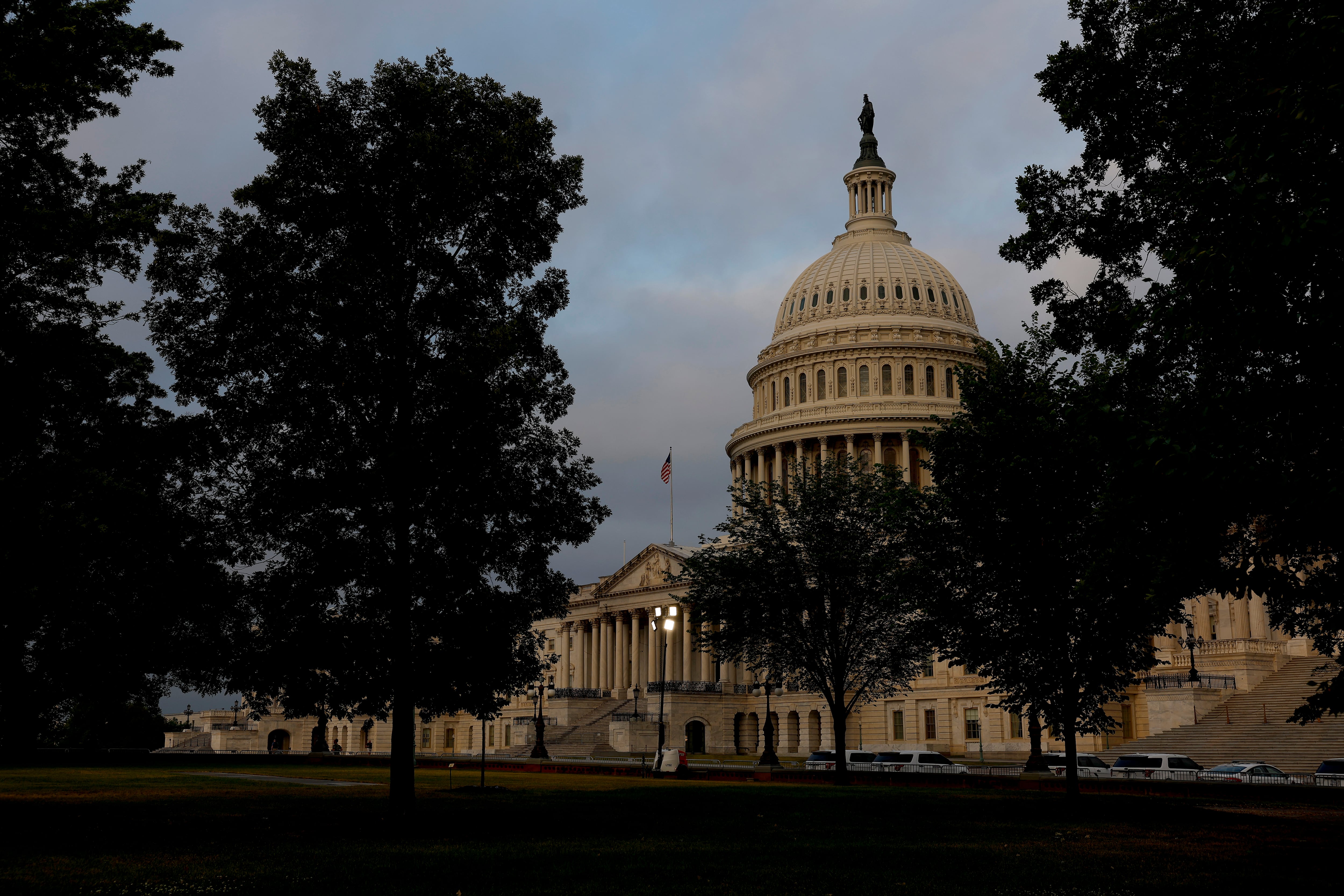 The sun rises behind the U.S. Capitol Building on May 30, 2023 in Washington, D.C.