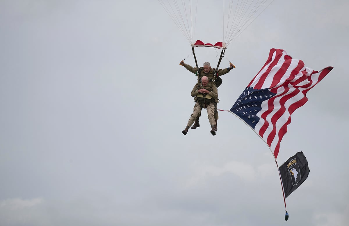 World War II D-Day veteran Tom Rice parachutes in a tandem jump into a field in Carentan, Normandy, France.