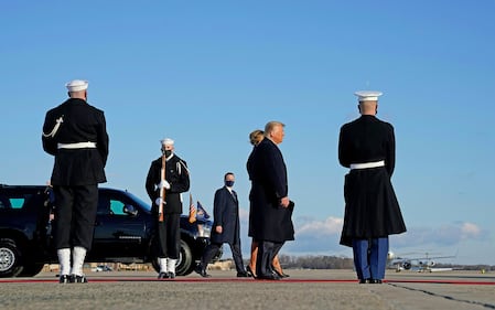 Outgoing President Donald Trump and first lady Melania Trump descend Marine One as they arrive at Joint Base Andrews in Maryland on Jan. 20, 2021.