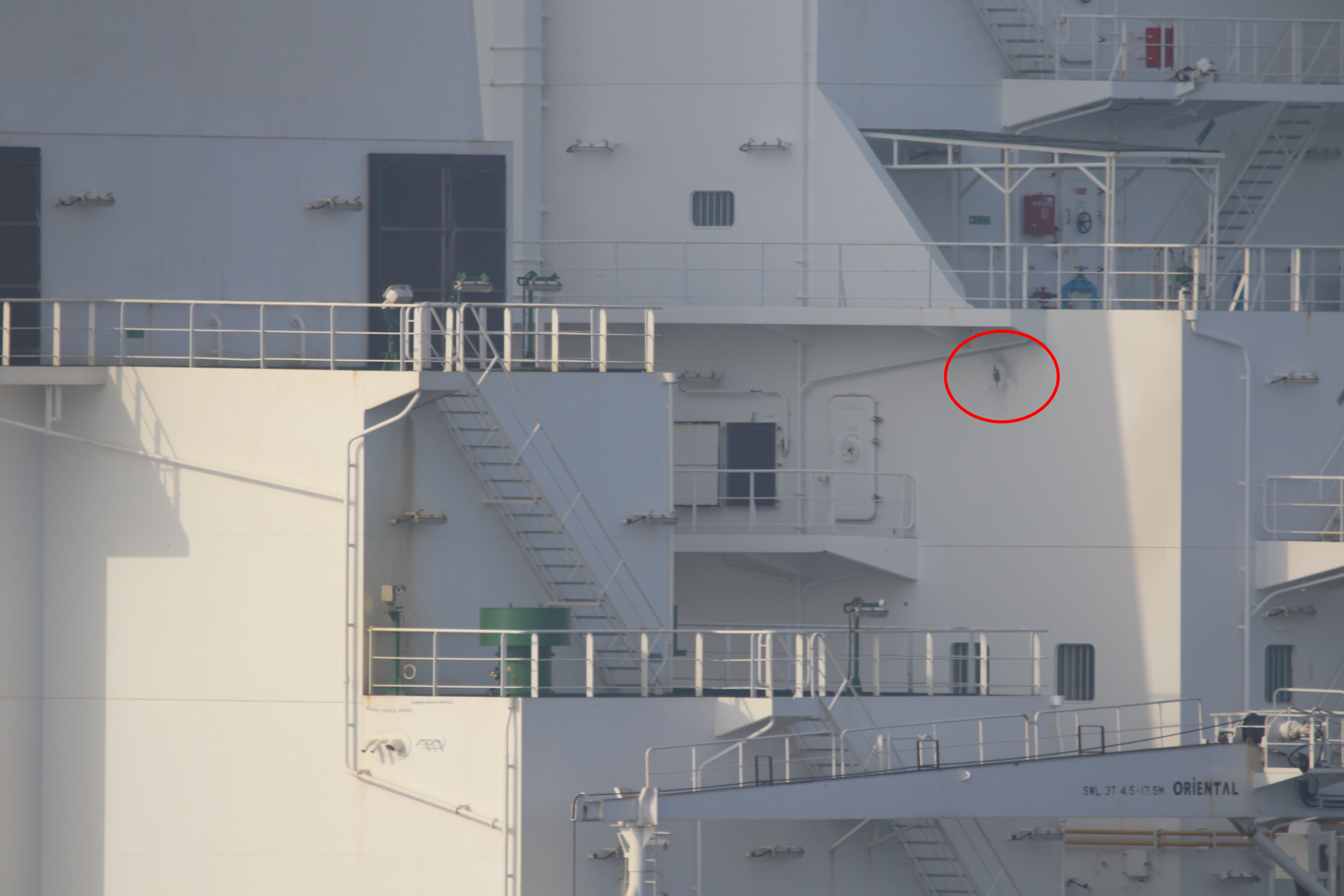 This photo, released by the U.S. Navy, shows damage sustained by the commercial tanker Richmond Voyager.