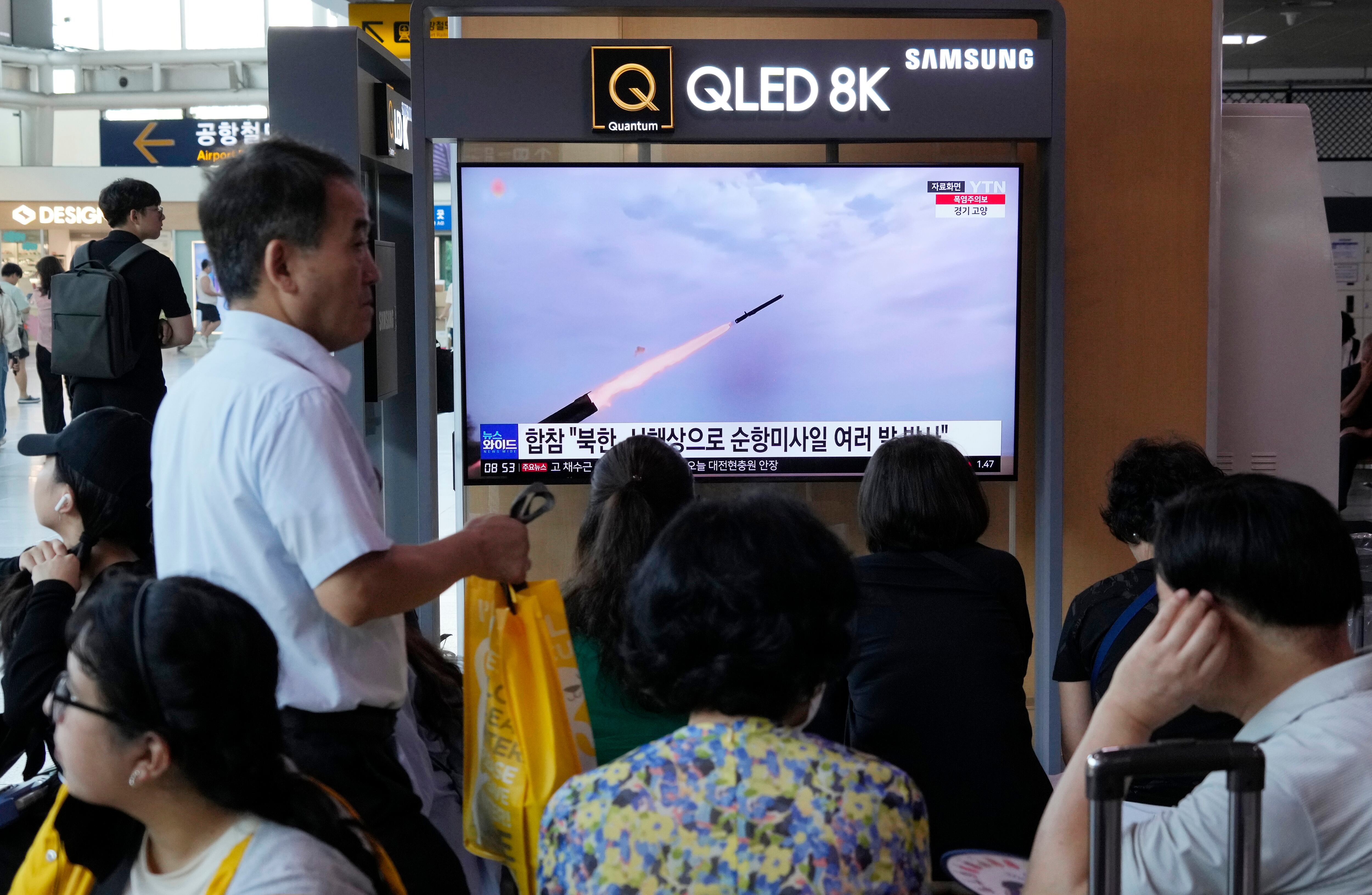 A TV screen shows a file image of North Korea's missile launch during a news program at the Seoul Railway Station in Seoul, South Korea, Saturday, July 22, 2023.