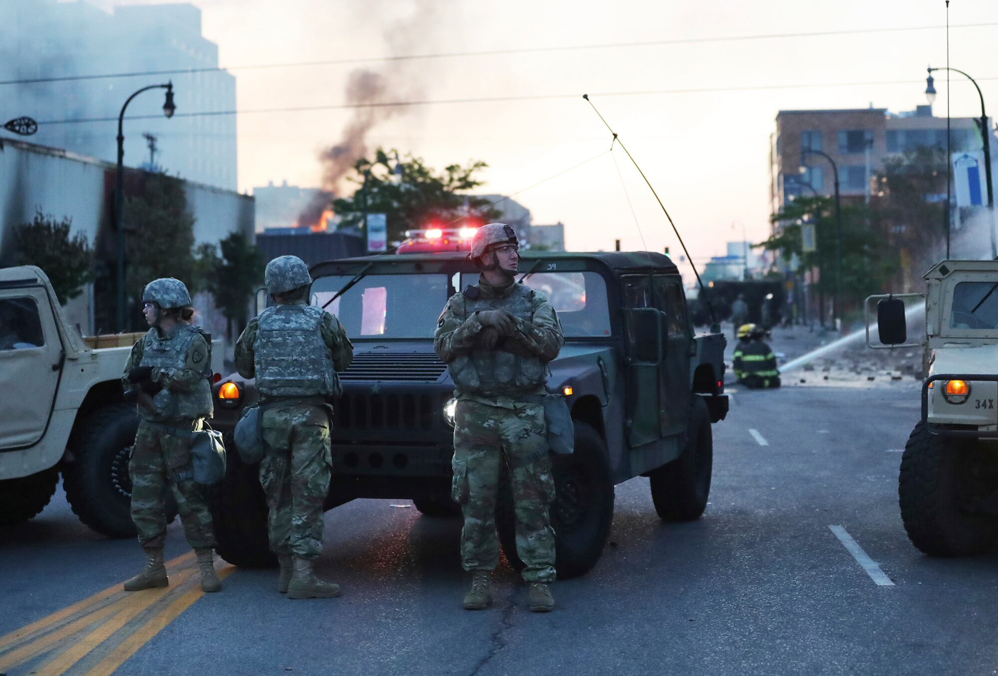 Minnesota National Guard members maintain a position protecting nearby firefighters in the wake of the death of George Floyd while in police custody earlier in the week and seen Saturday, May 30, 2020, in Minneapolis.