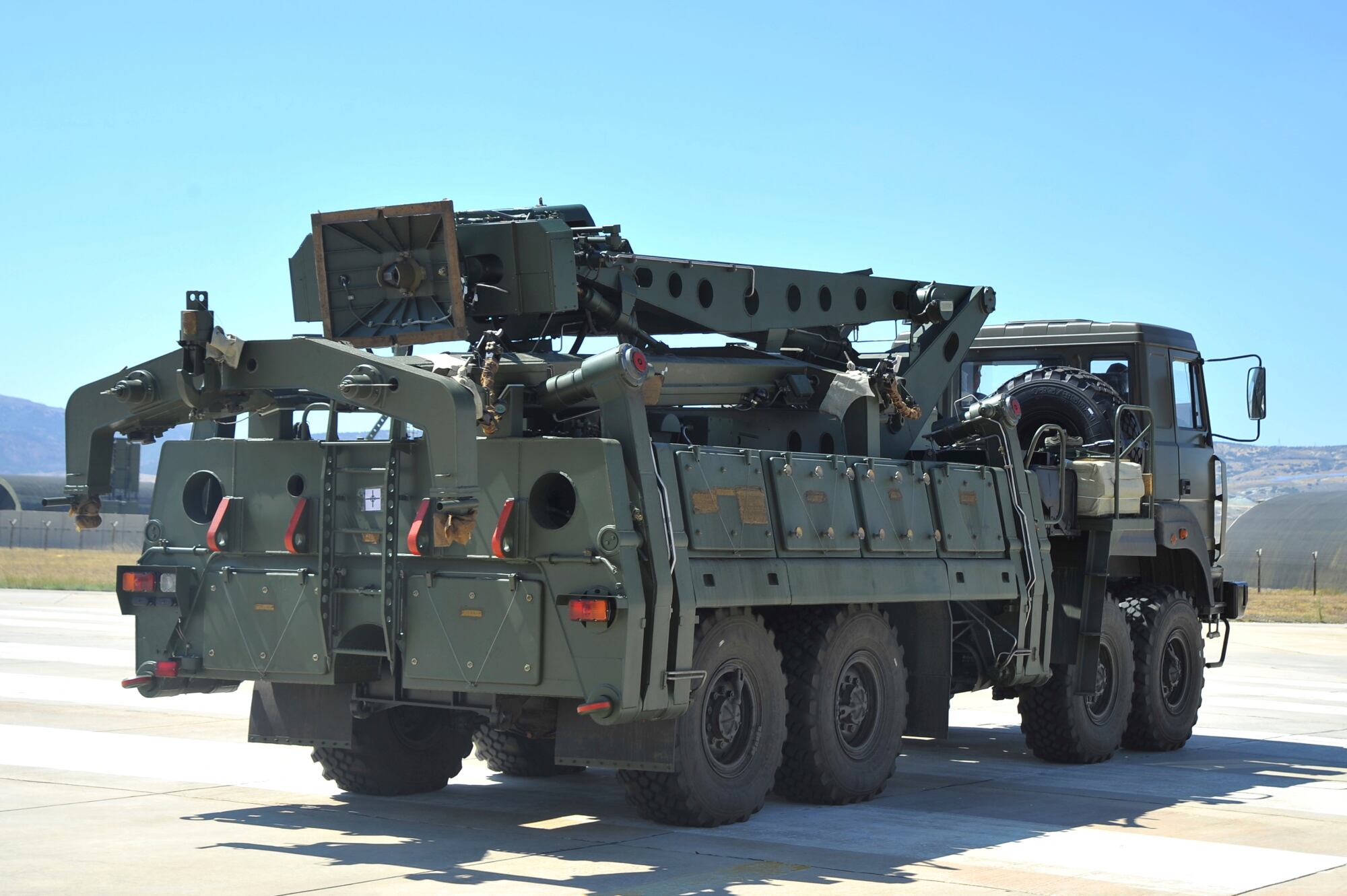 In this Aug. 27, 2019, file photo, a truck carrying parts of the S-400 air defense systems, exits a Russian transport aircraft after landing at Murted military airport outside Ankara, Turkey.