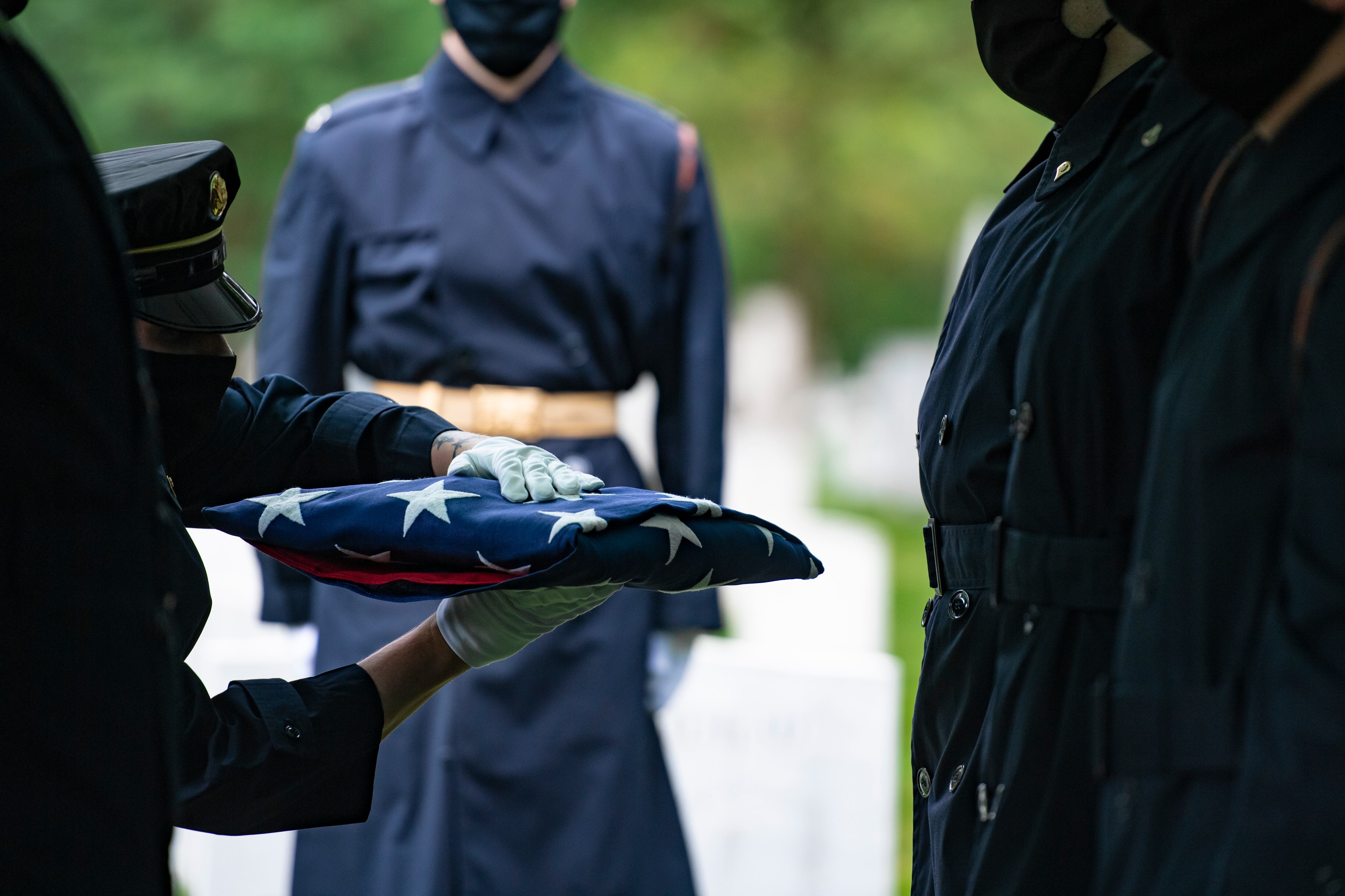 Soldiers assigned to 1st Battalion, 3d U.S. Infantry Regiment (The Old Guard) conduct modified military funeral honors for an Army Air Forces airman in Section 1 of Arlington National Cemetery, Arlington, Virginia, June 11, 2020.