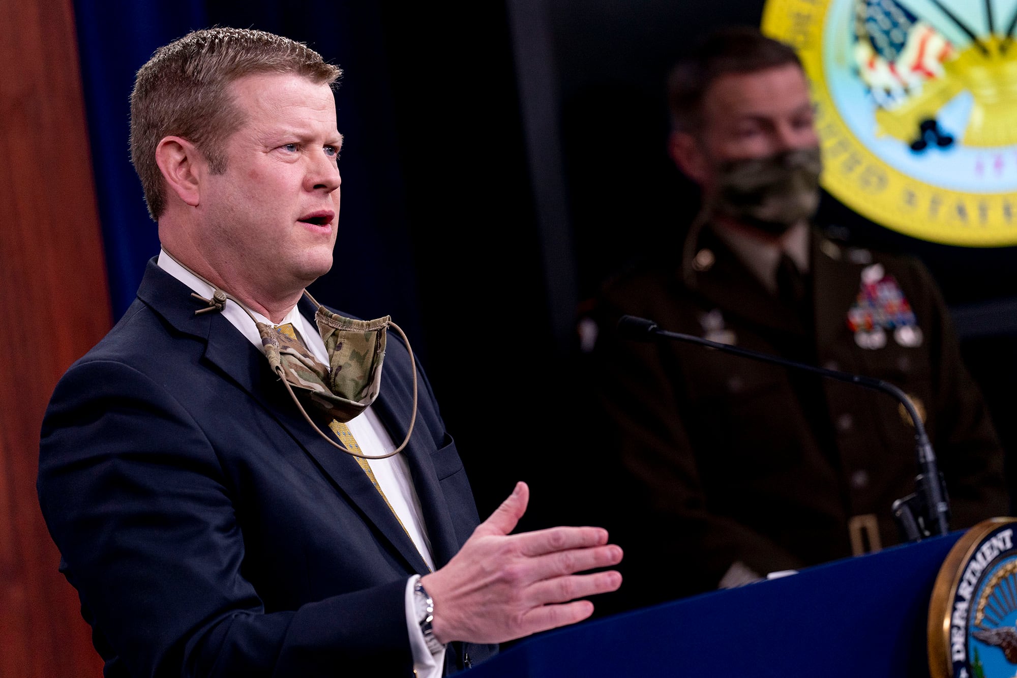 Secretary of the Army Ryan McCarthy, left, accompanied by Gen. James McConville, chief of staff of the Army, right, speaks during a briefing on an investigation into Fort Hood, Texas, at the Pentagon, Tuesday, Dec. 8, 2020, in Washington.