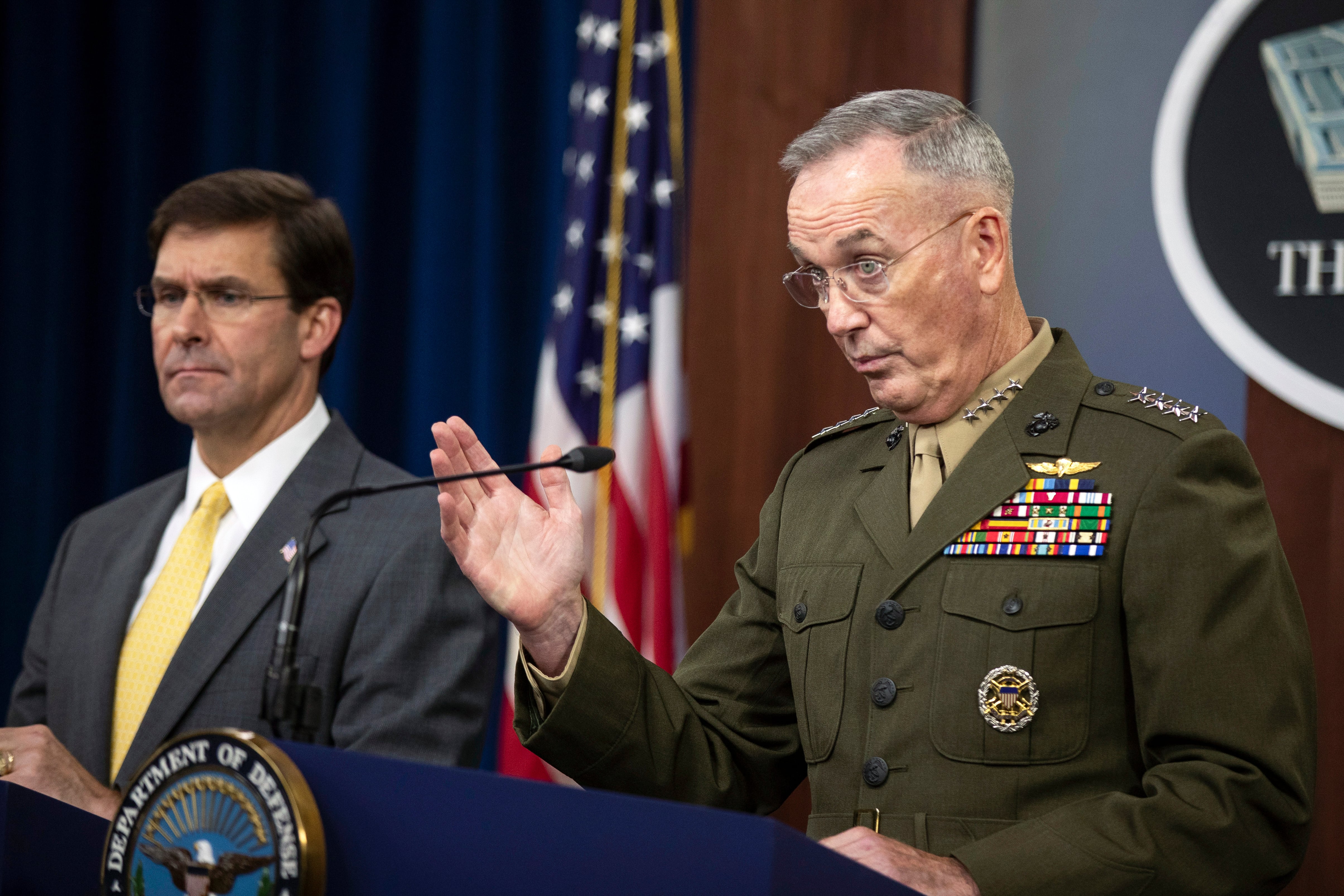 Joint Chiefs Chairman Gen. Joseph Dunford with Secretary of Defense Mark Esper speaks to reporters during a briefing at the Pentagon, Wednesday, Aug. 28, 2019.