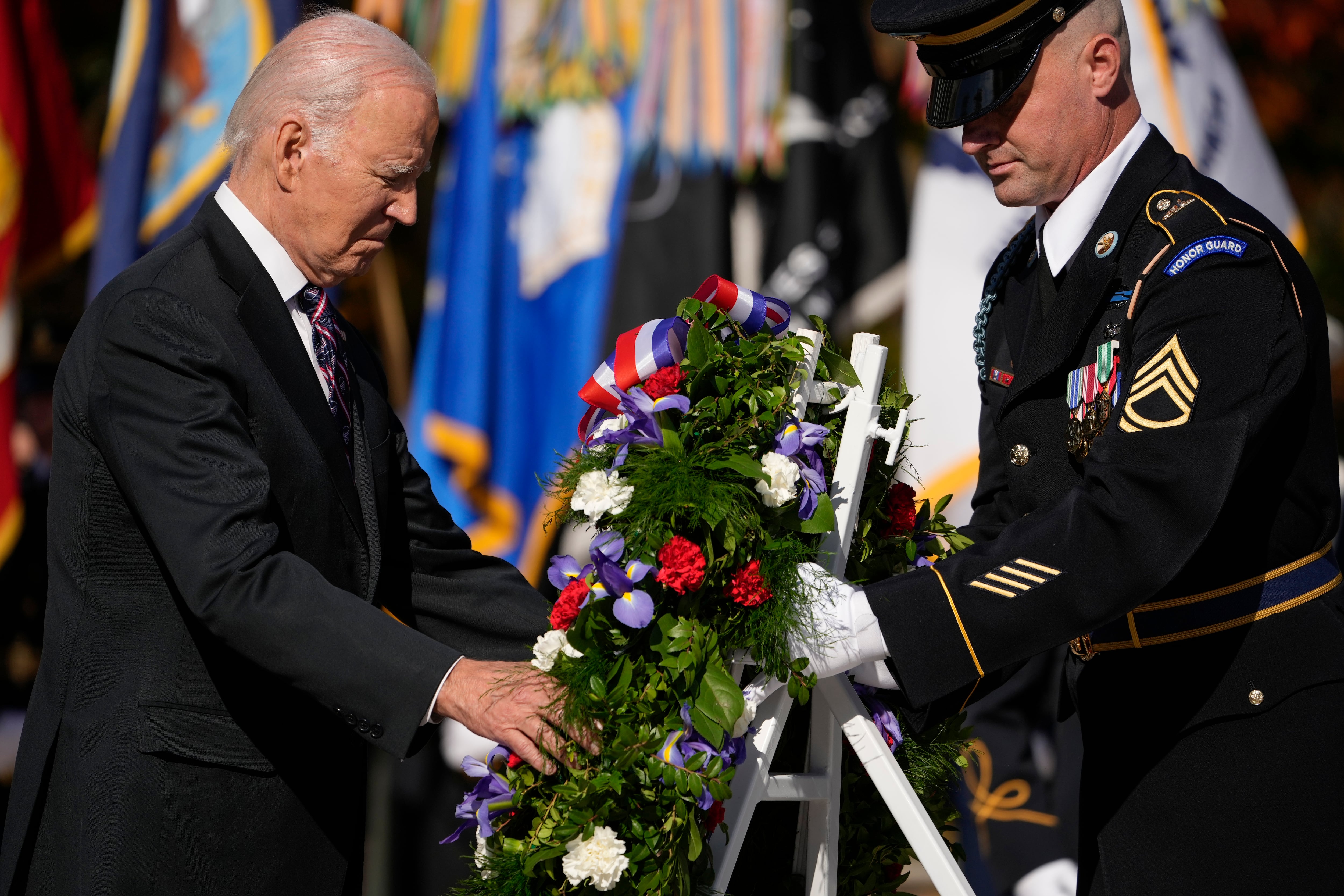 President Joe Biden lays a wreath at the Tomb of the Unknown Soldier at Arlington National Cemetery in Arlington, Va., Saturday, Nov. 11, 2023.