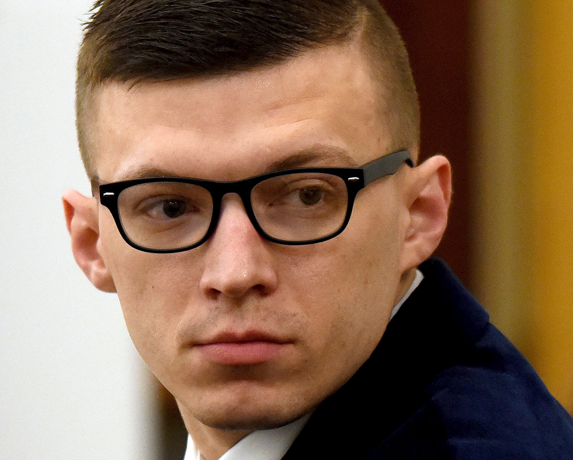 Volodymyr Zhukovskyy looks back at the gallery before closing statements started at his trial at Coos County Superior Court in Lancaster, N.H., Aug. 9, 2022.