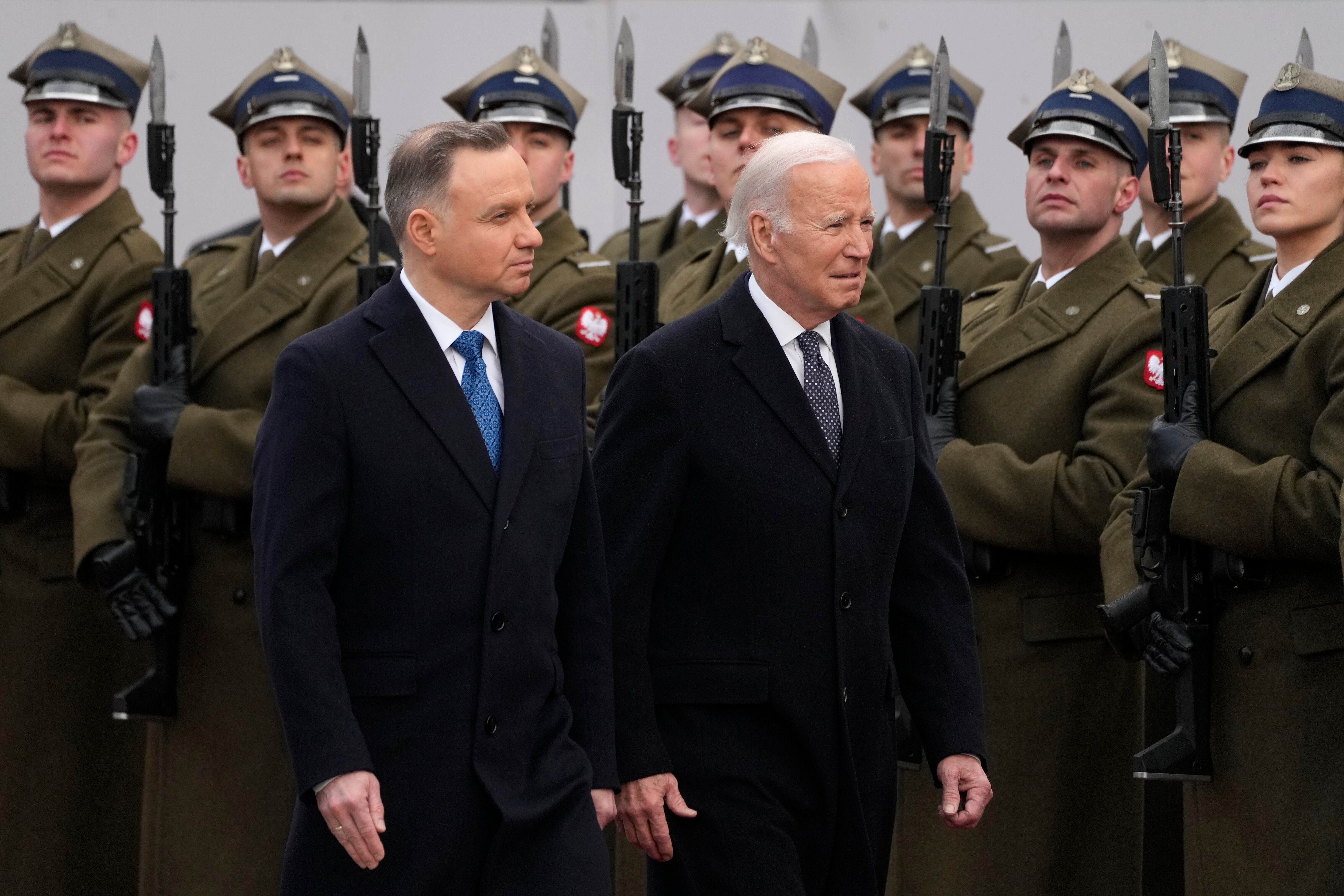 Polish President Andrzej Duda, left, welcomes President Joe Biden at the Presidential Palace in Warsaw, Ukraine, Tuesday, Feb. 21, 2023