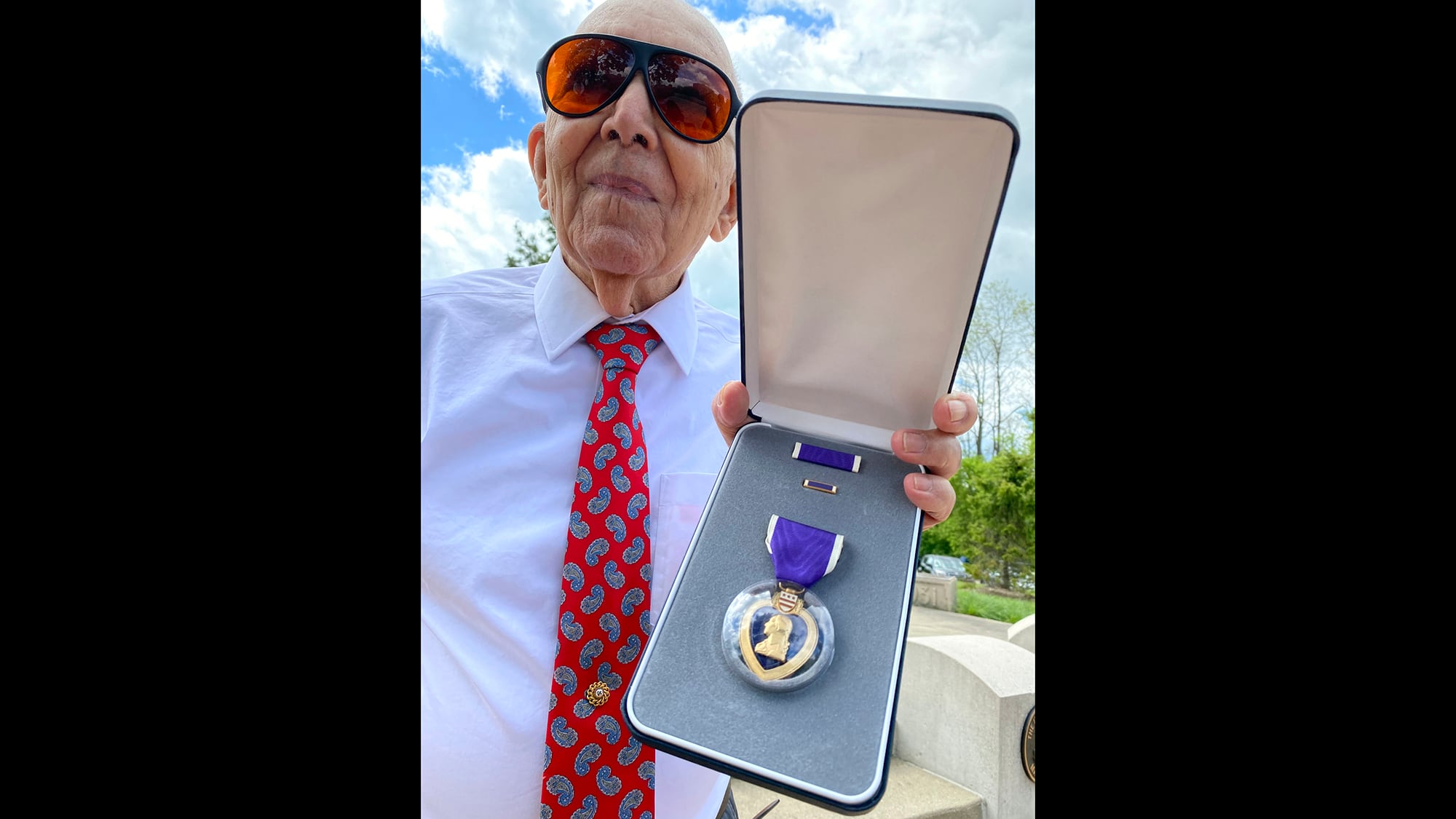 Marcos Montano, of Waukegan, Ill., shows off his replacement Purple Heart medal in Waukegan on May 30, 2020.