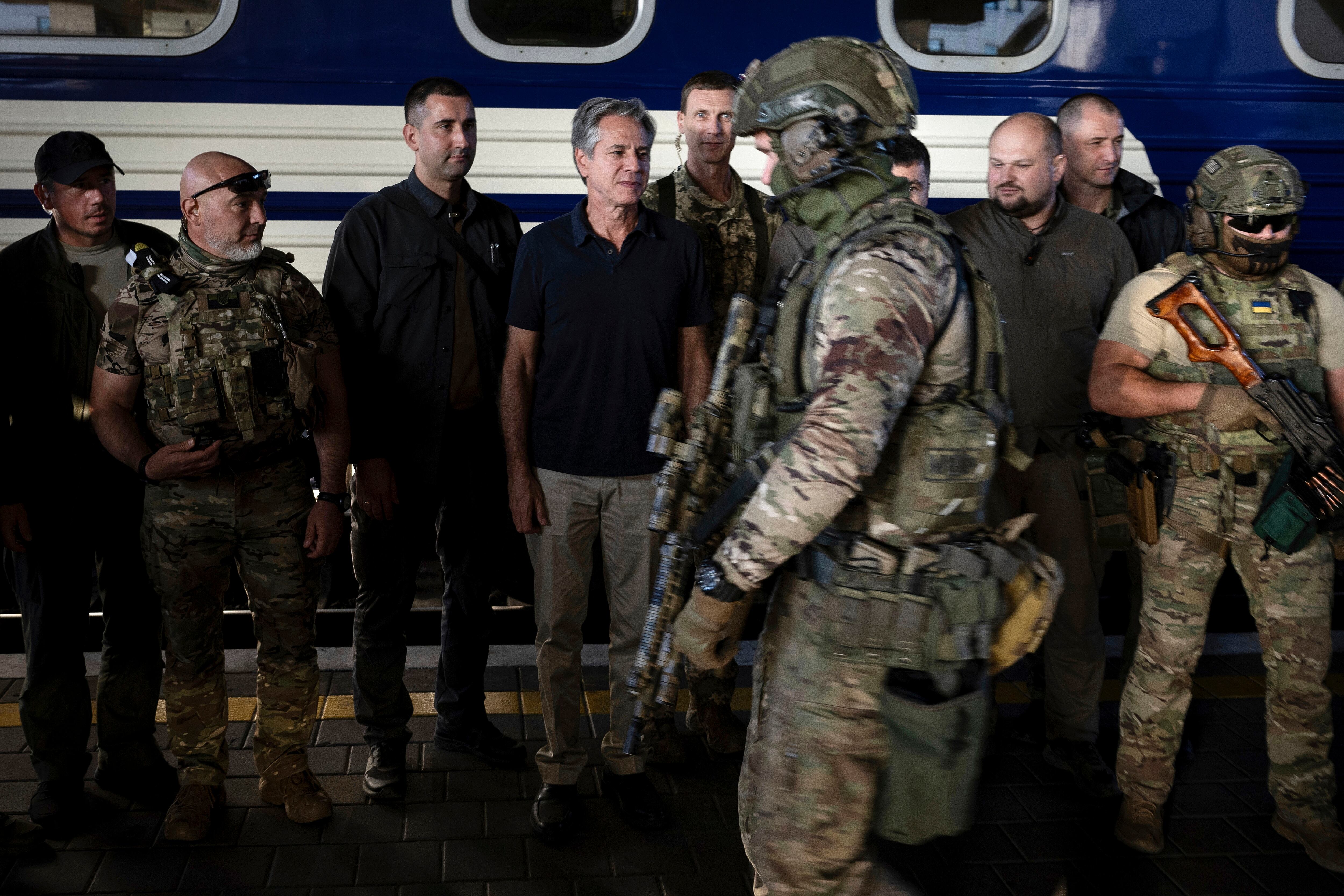 U.S. Secretary of State Antony Blinken, center, stands next to Ukrainian security forces before departing a train station in Kyiv, Ukraine, on Thursday, Sept. 7, 2023.