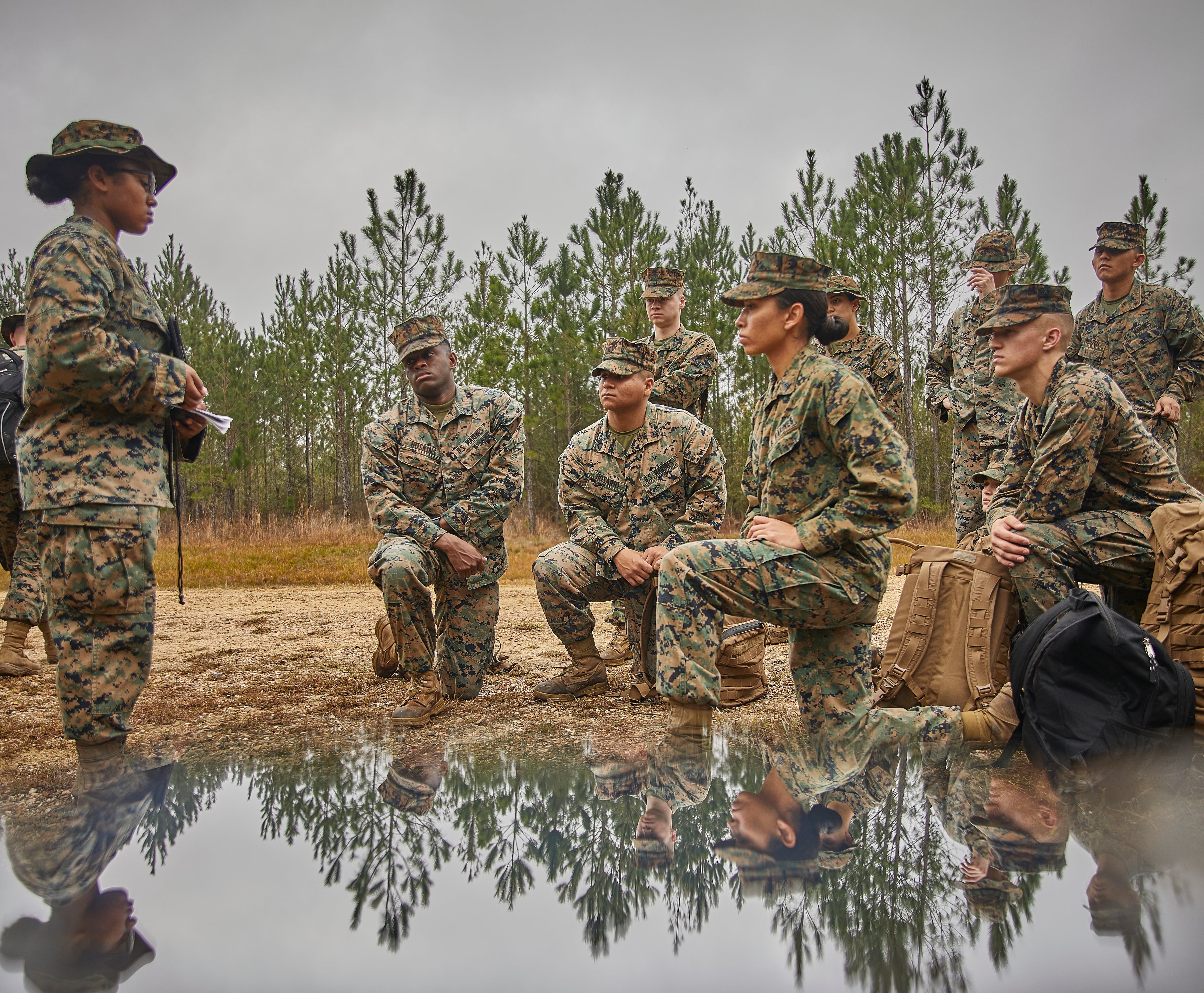 Marines with Marine Corps Support Facility New Orleans watch a resiliency training video between events during a field exercise at Camp Villere, Slidell, Louisiana, March 12, 2020.