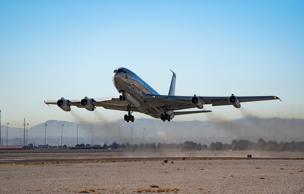 An E-8C, Joint Surveillance Target Attack Radar System, or Joint STARS, takes off for a Weapons School integration mission at Nellis Air Force Base, Nevada, Nov. 22, 2021. The primary mission is to provide theater ground and air commanders with ground surveillance to support attack operations and targeting that contributes to the delay, disruption and destruction of enemy forces. (William Lewis/Air Force)