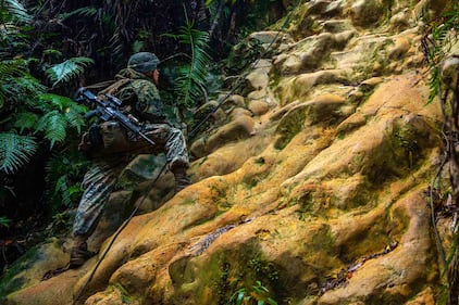 U.S. Marine Corps Lance Cpl. Ethan Sawyer conducts route reconnaissance during the 3d Marine Division Rifle Squad Competition at Camp Gonsalves, Okinawa, Japan, Jan. 11, 2021.