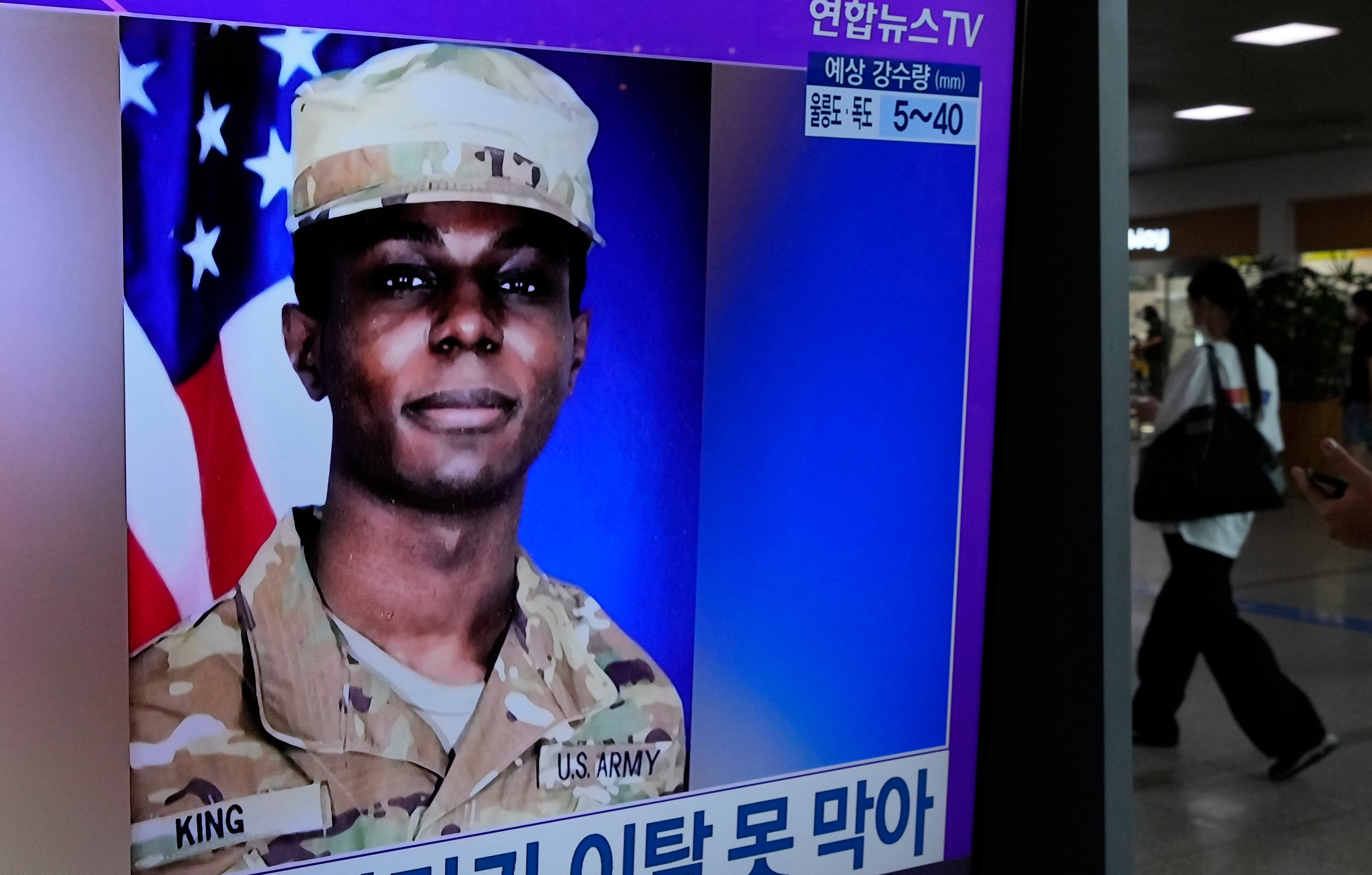 A TV screen shows a file image of American soldier Travis King during a news program at the Seoul Railway Station in Seoul, South Korea, Monday, July 24, 2023.