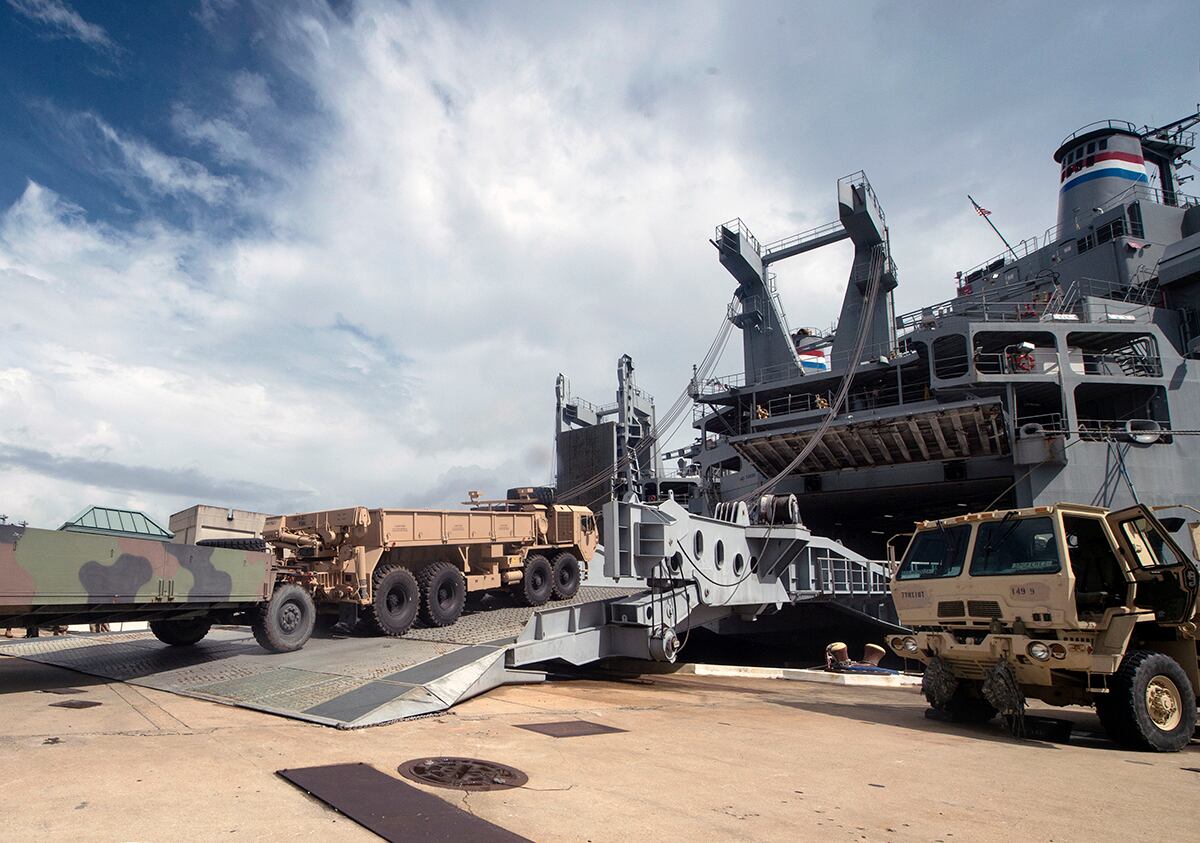 Army vehicles and assets are moved onto a vessel during exercise Dragon Lifeline on July 31, 2018, at the Federal Law Enforcement Training Center in Charleston, S.C.